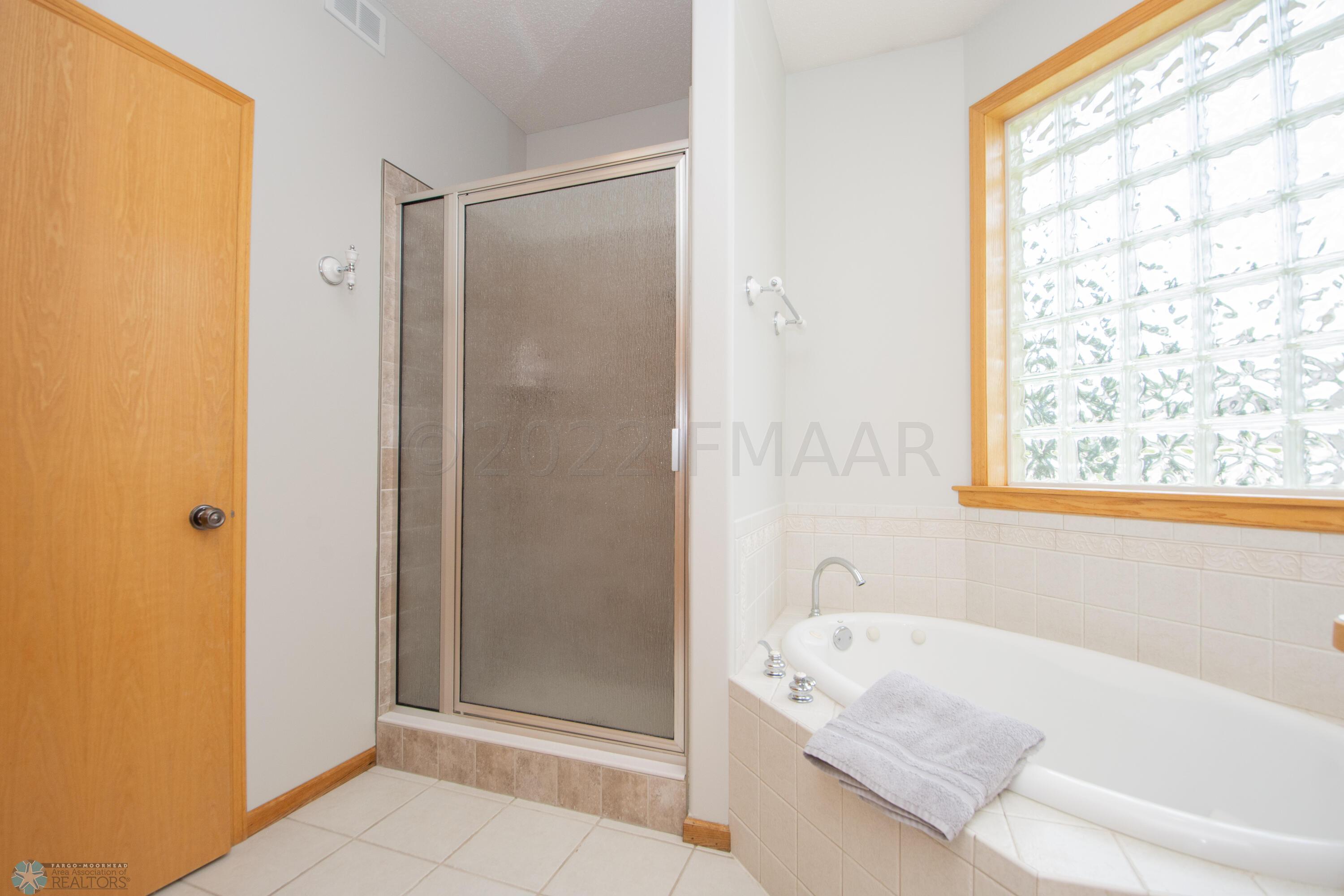 On suite-double vanity/tub/tile shower