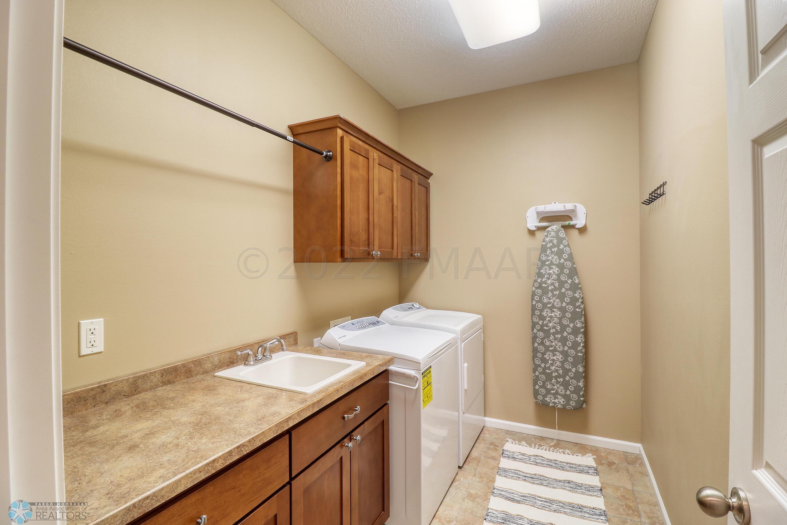 Main Floor Laundry with Sink off Garage