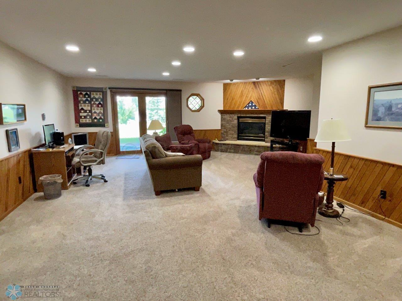 12-Family room with gas fireplace in wal