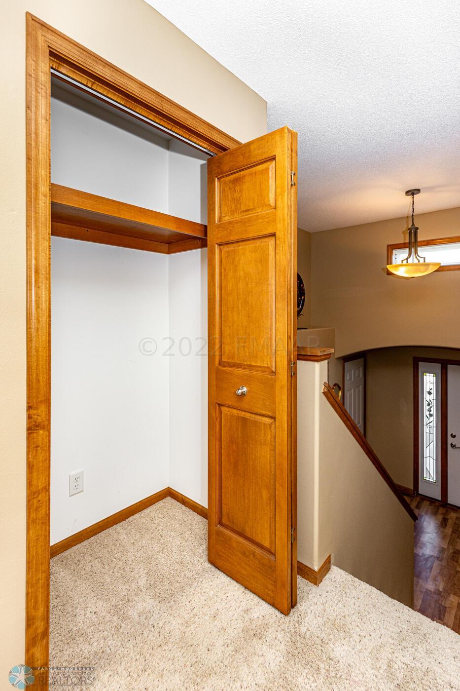 Coat Closet w/wood shelf
