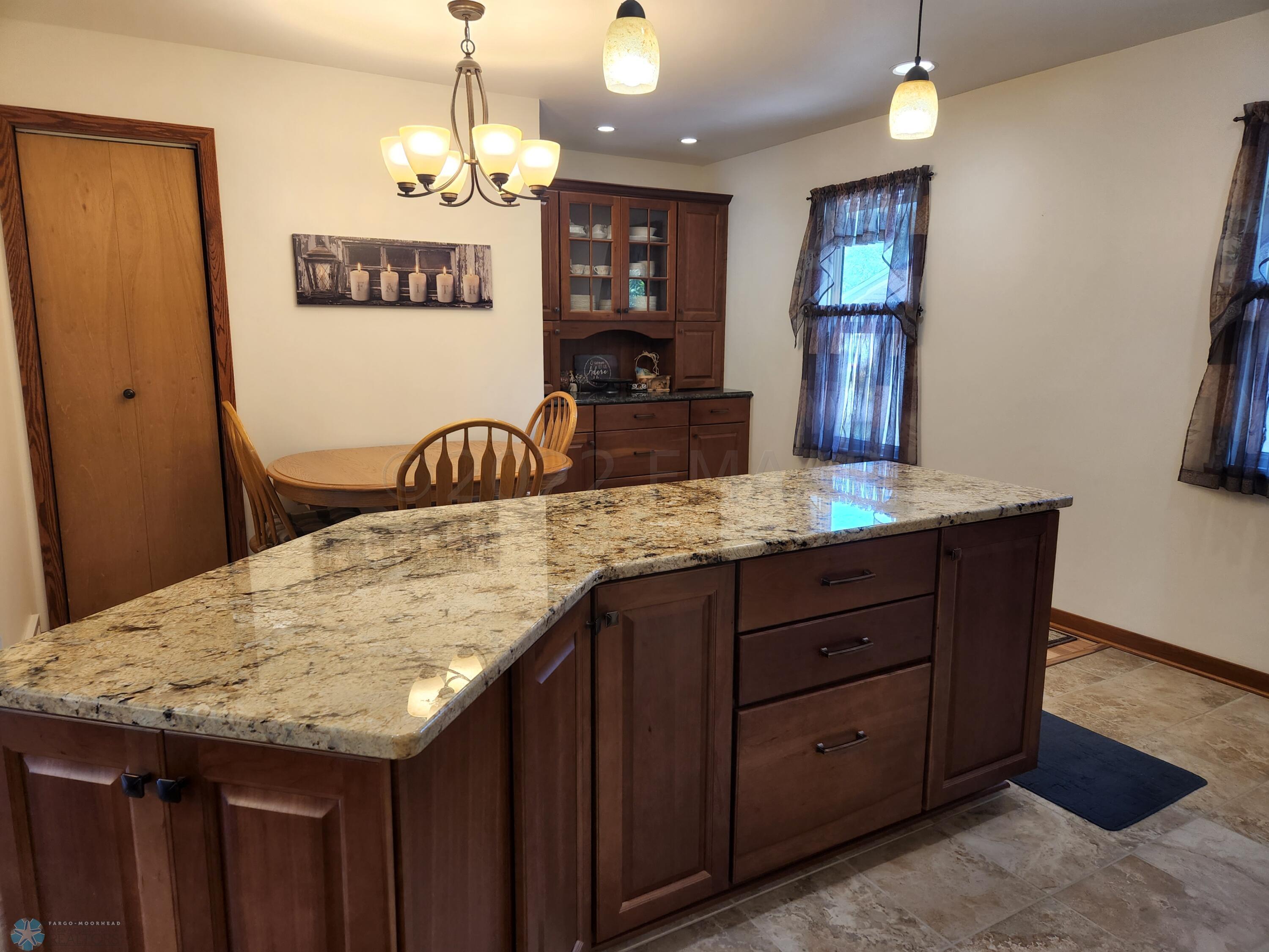 Island with Granite Countertop