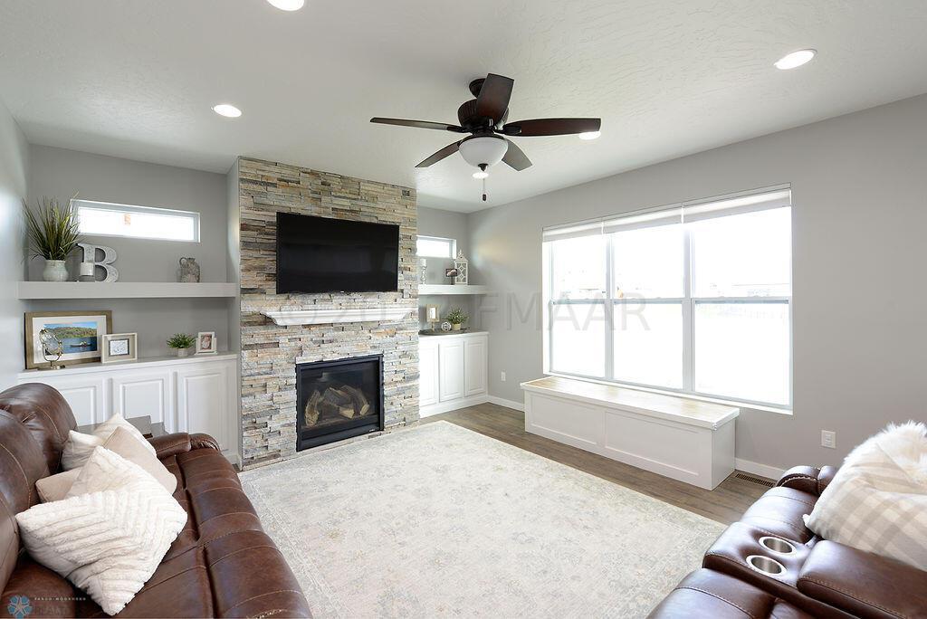 Bright Living Room with Stone Fireplace