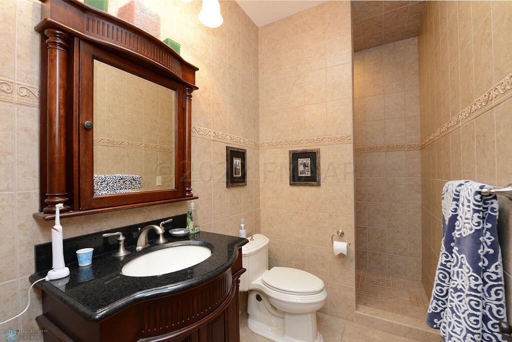 Main Bathroom with Tiled Shower