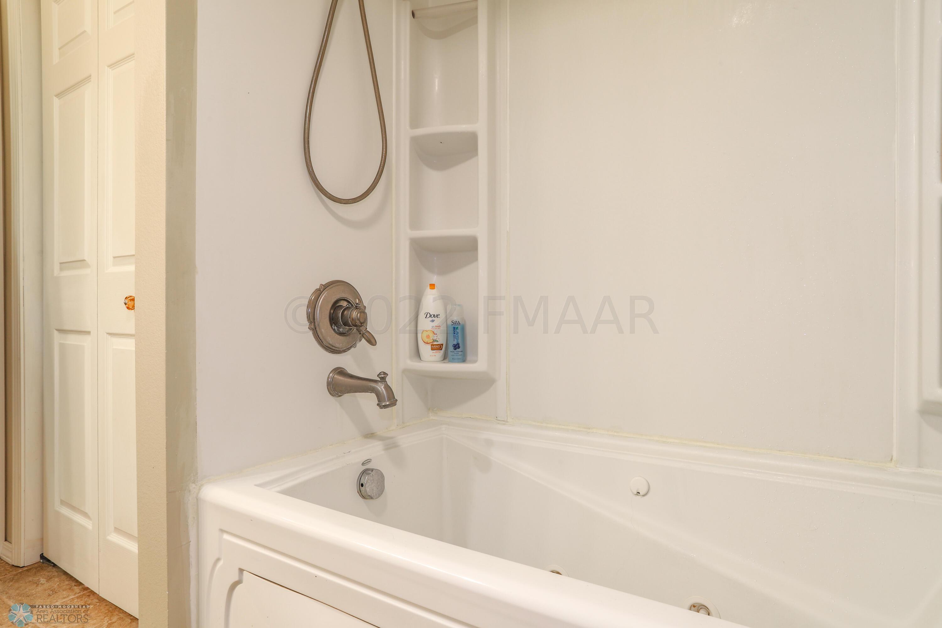 Jetted tub in lower level bath
