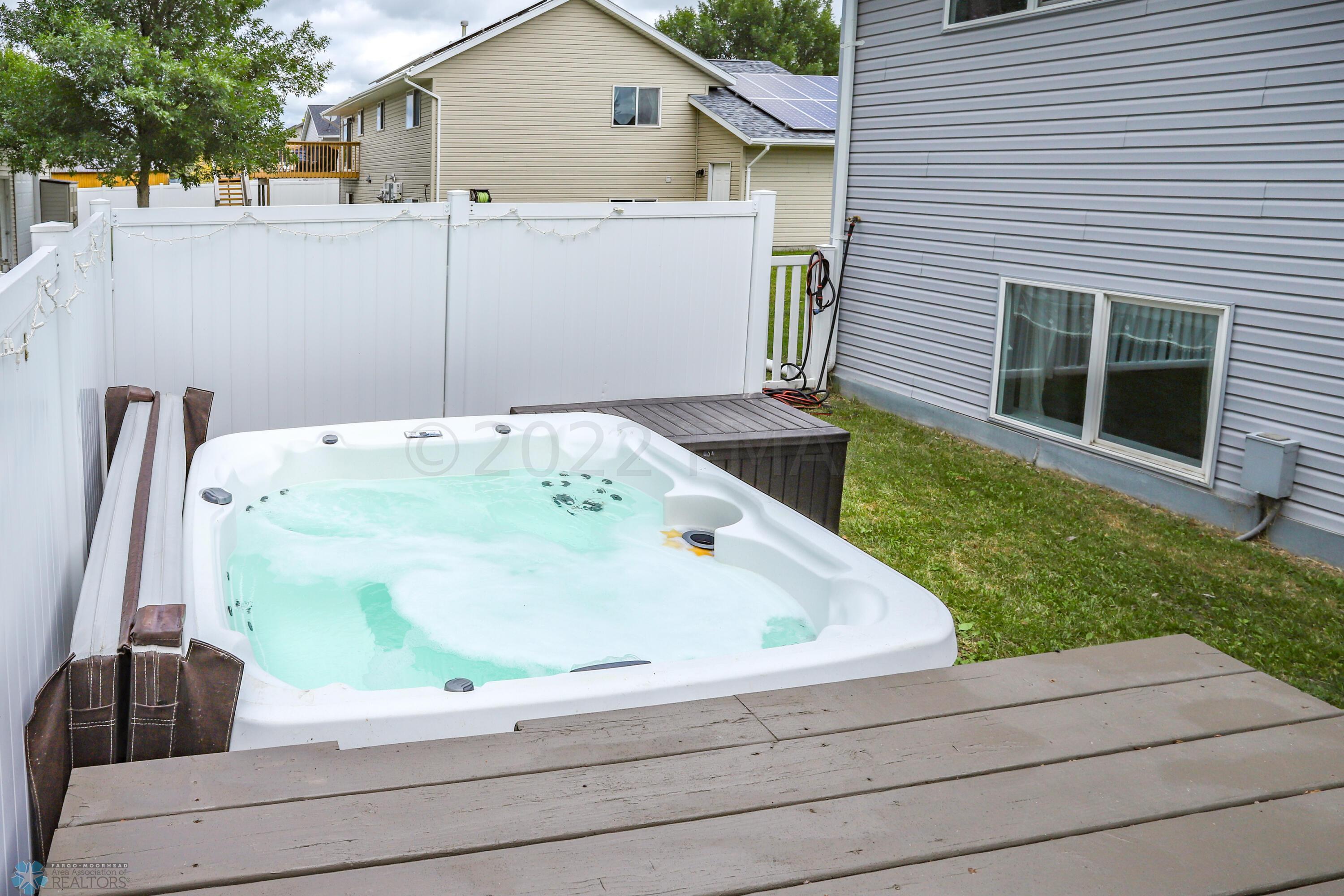 hot tub with privacy fence