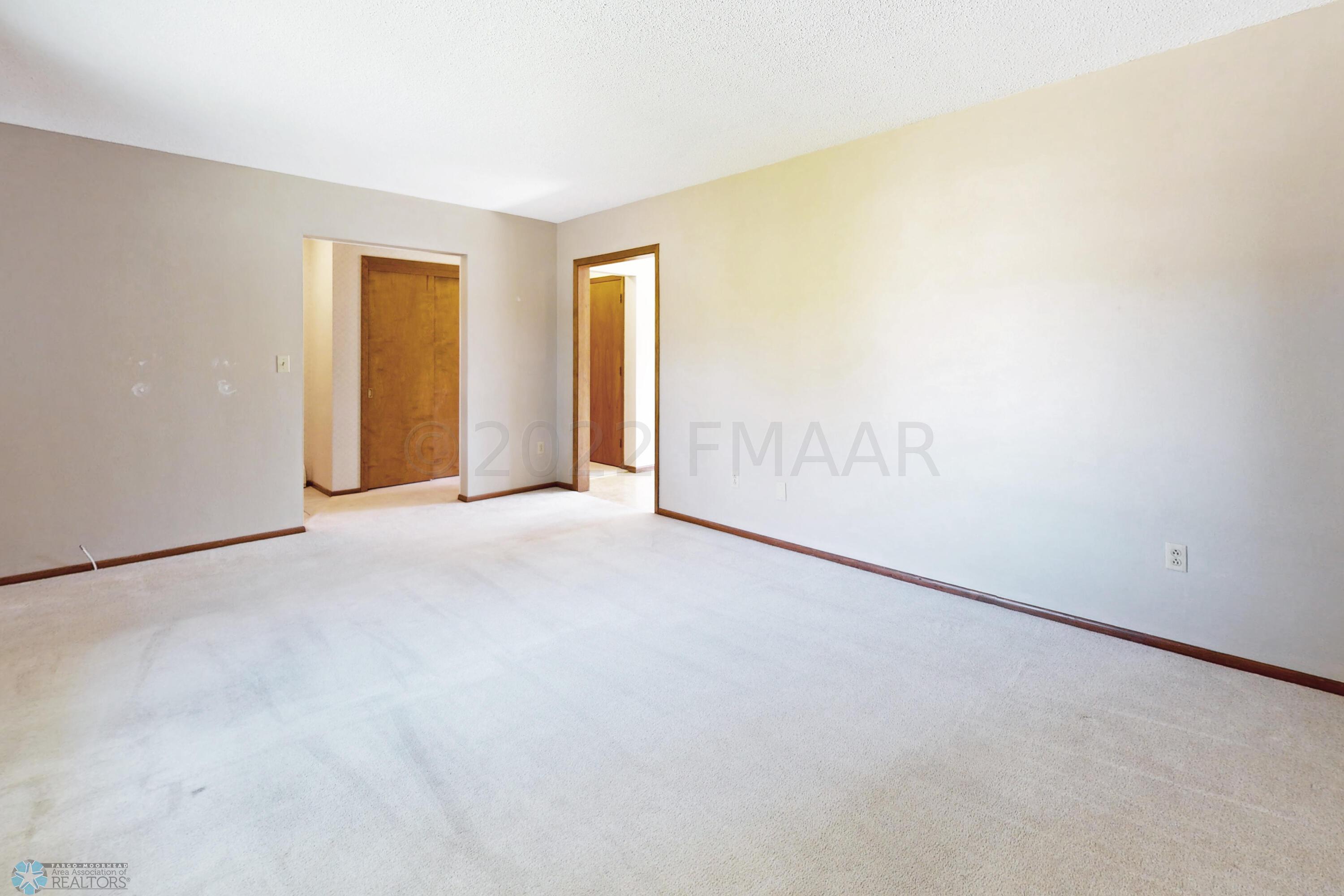 Living room towards hallway and kithen