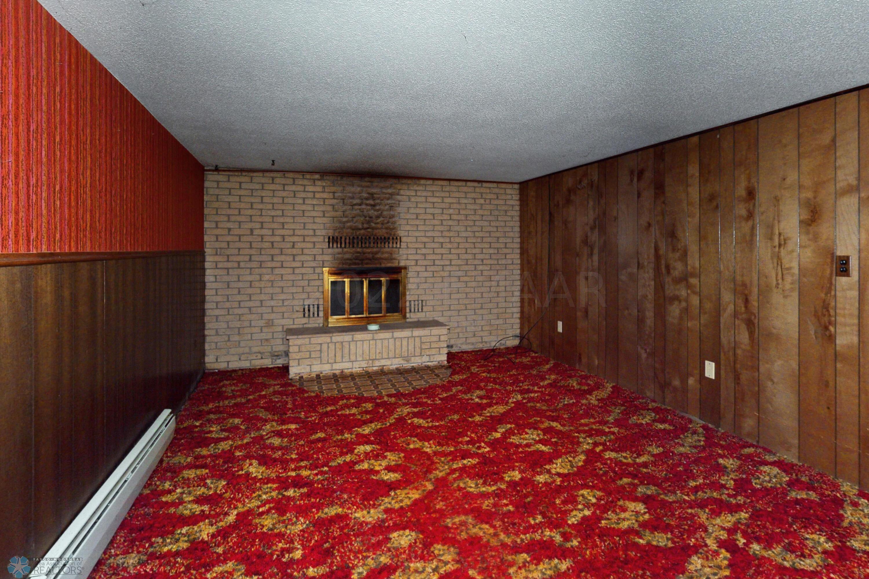 family room with wood burning fireplace
