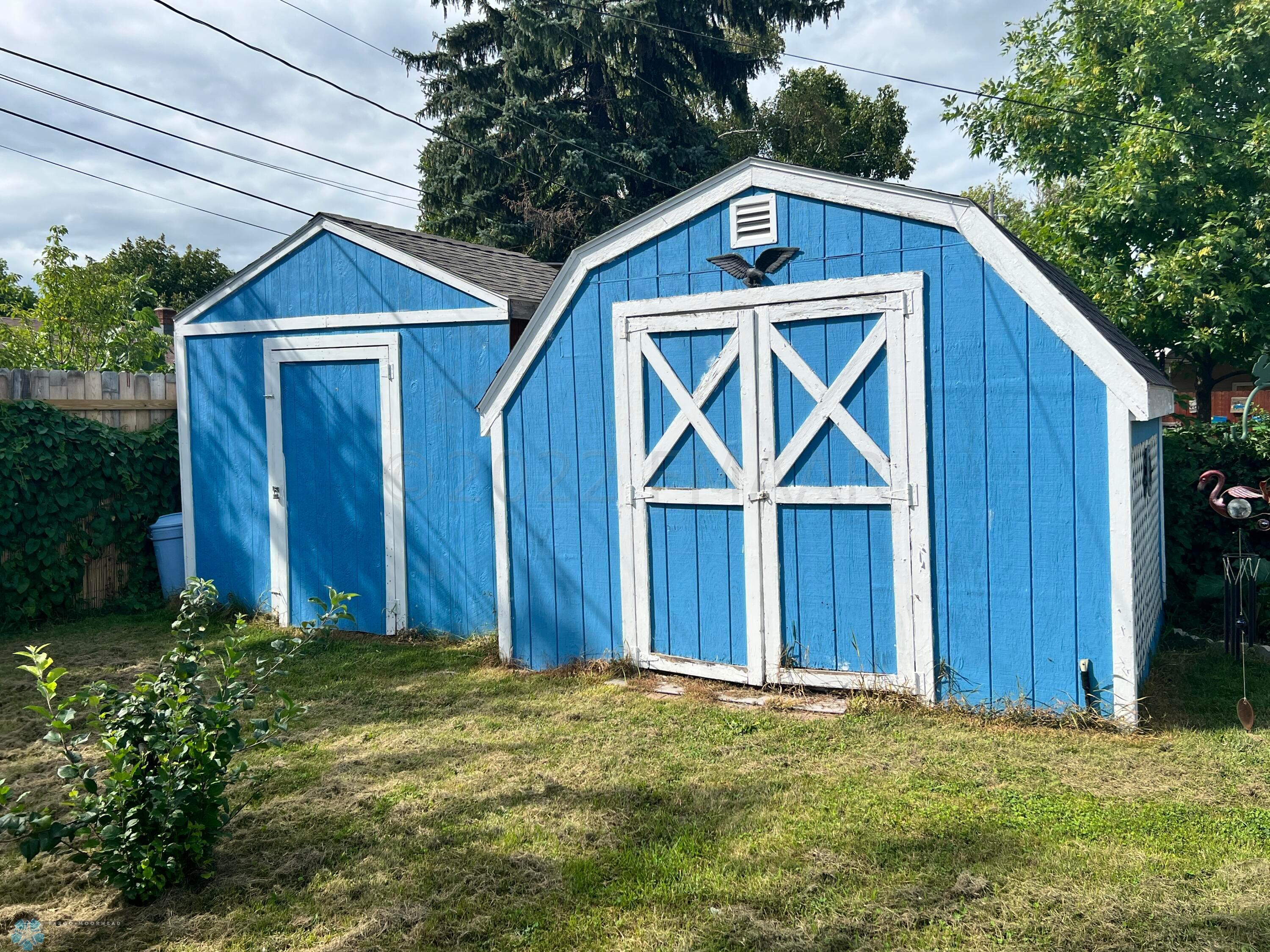 Storage sheds included