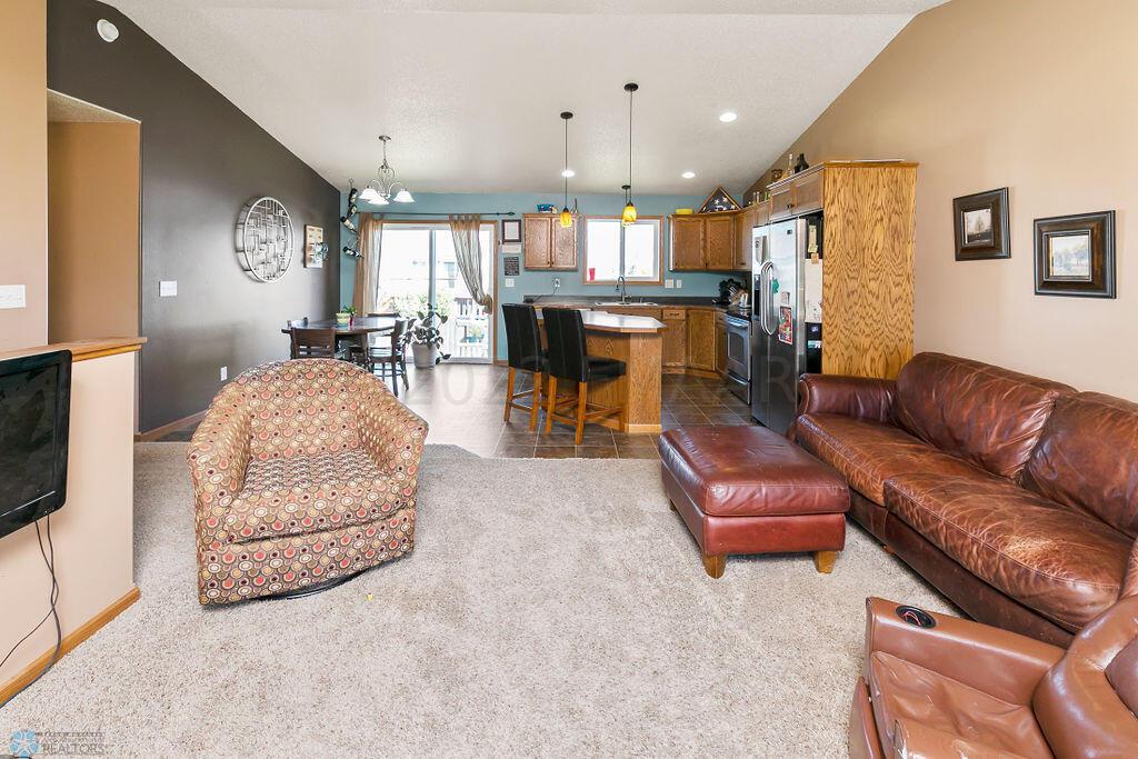Living room open to kitchen & dining