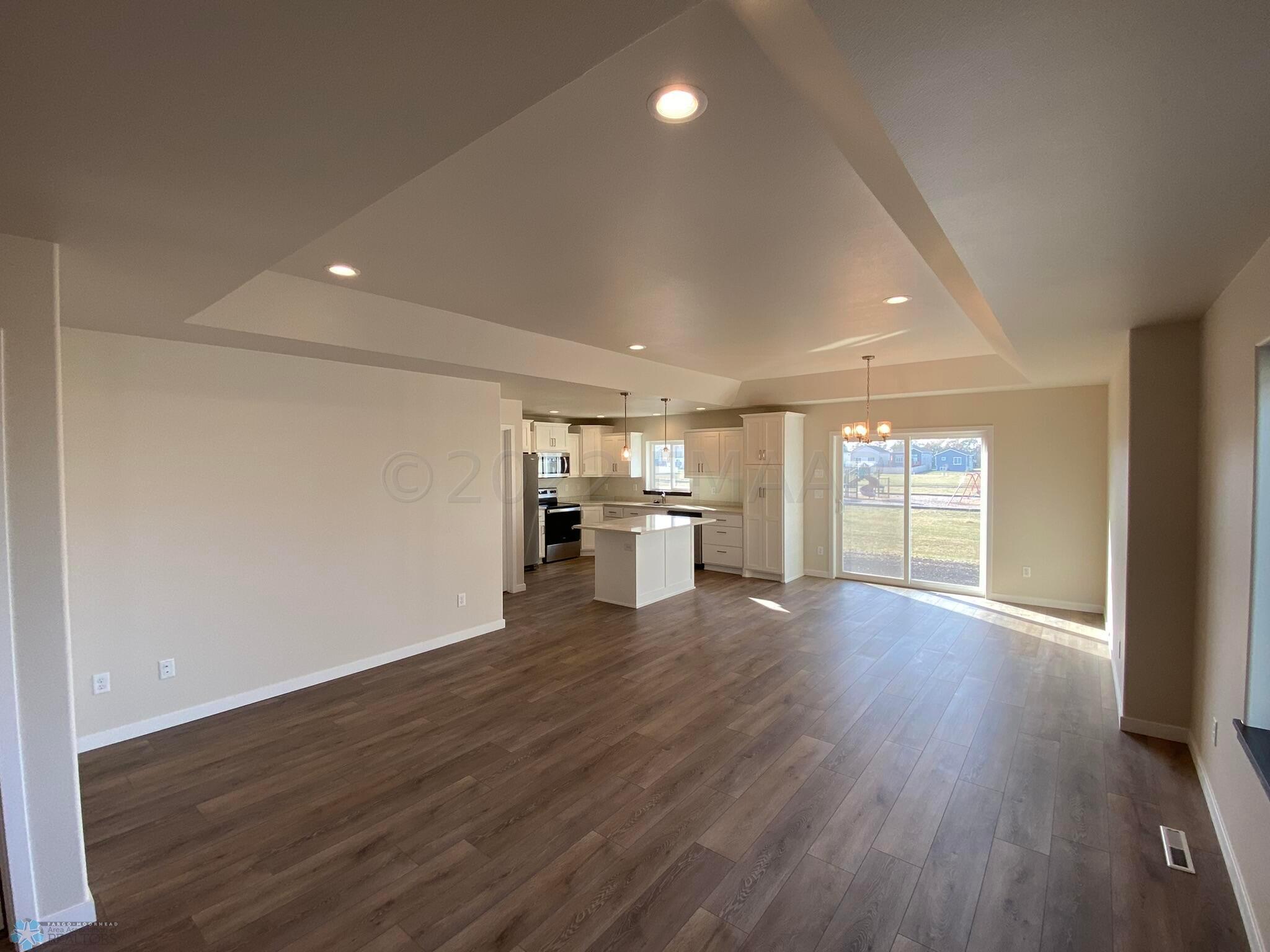 Open concept kitchen/dining/living room.