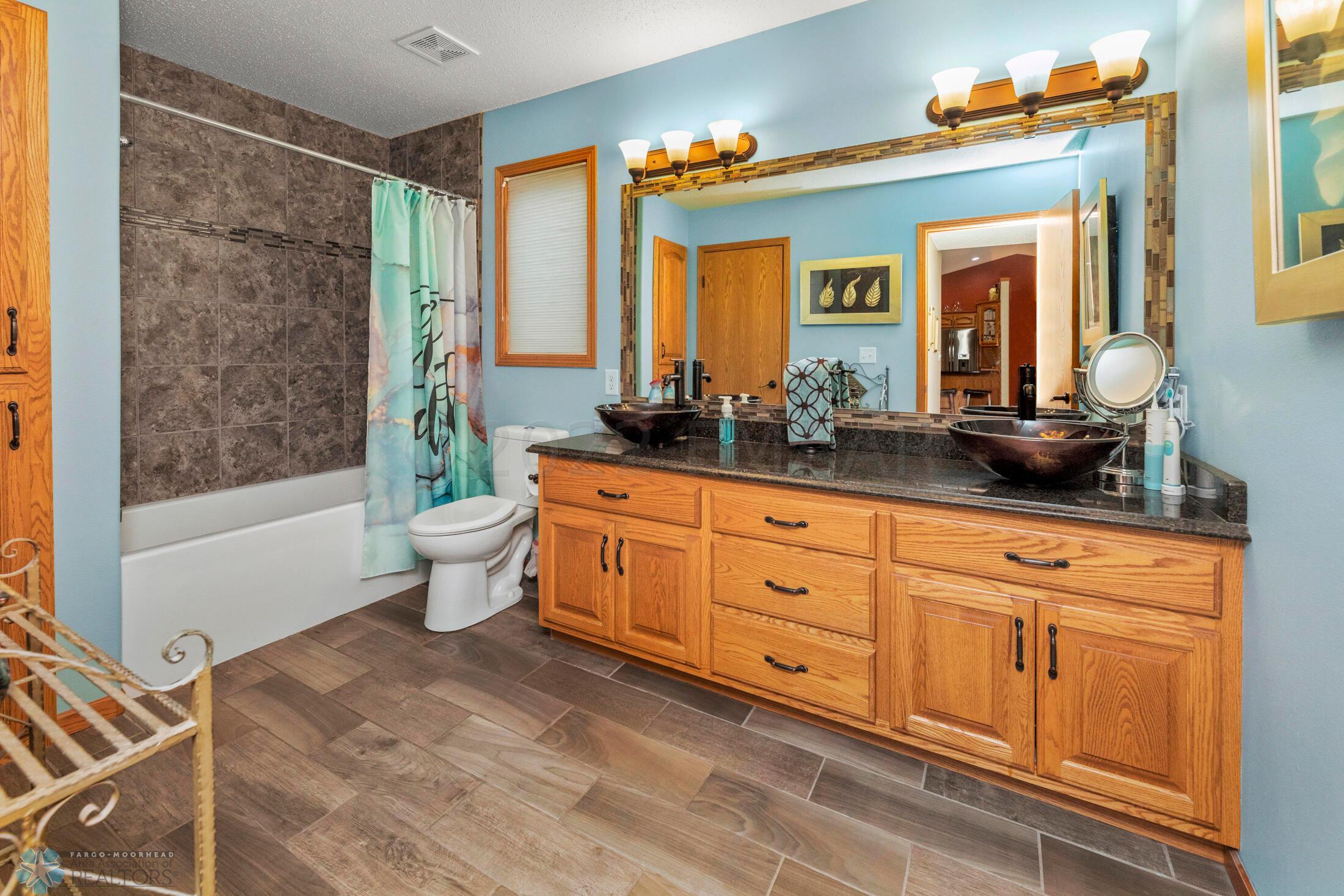 Tile shower/tub and 2 sink vanity