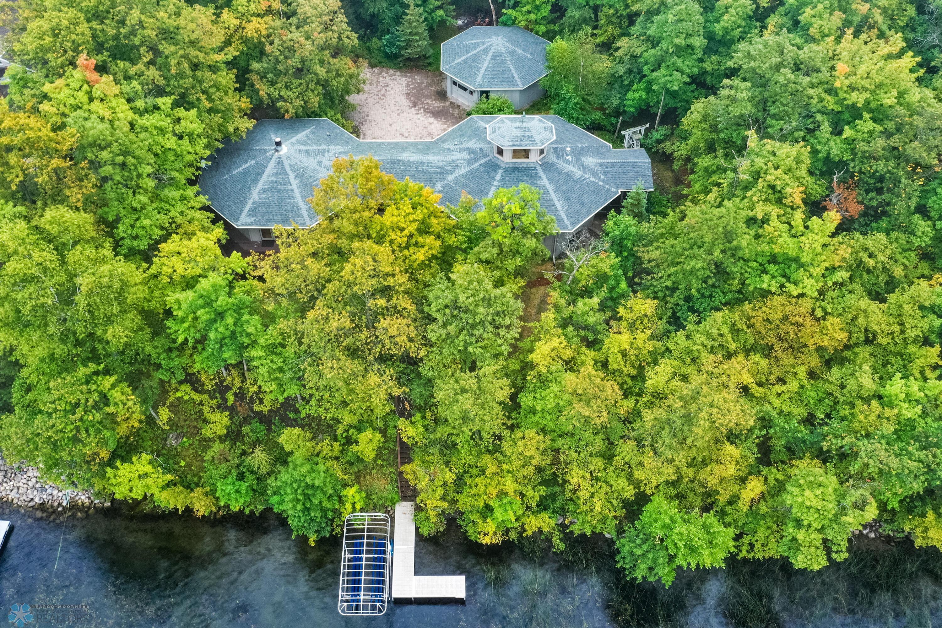 Nestled In Two Acres Of Private Woods