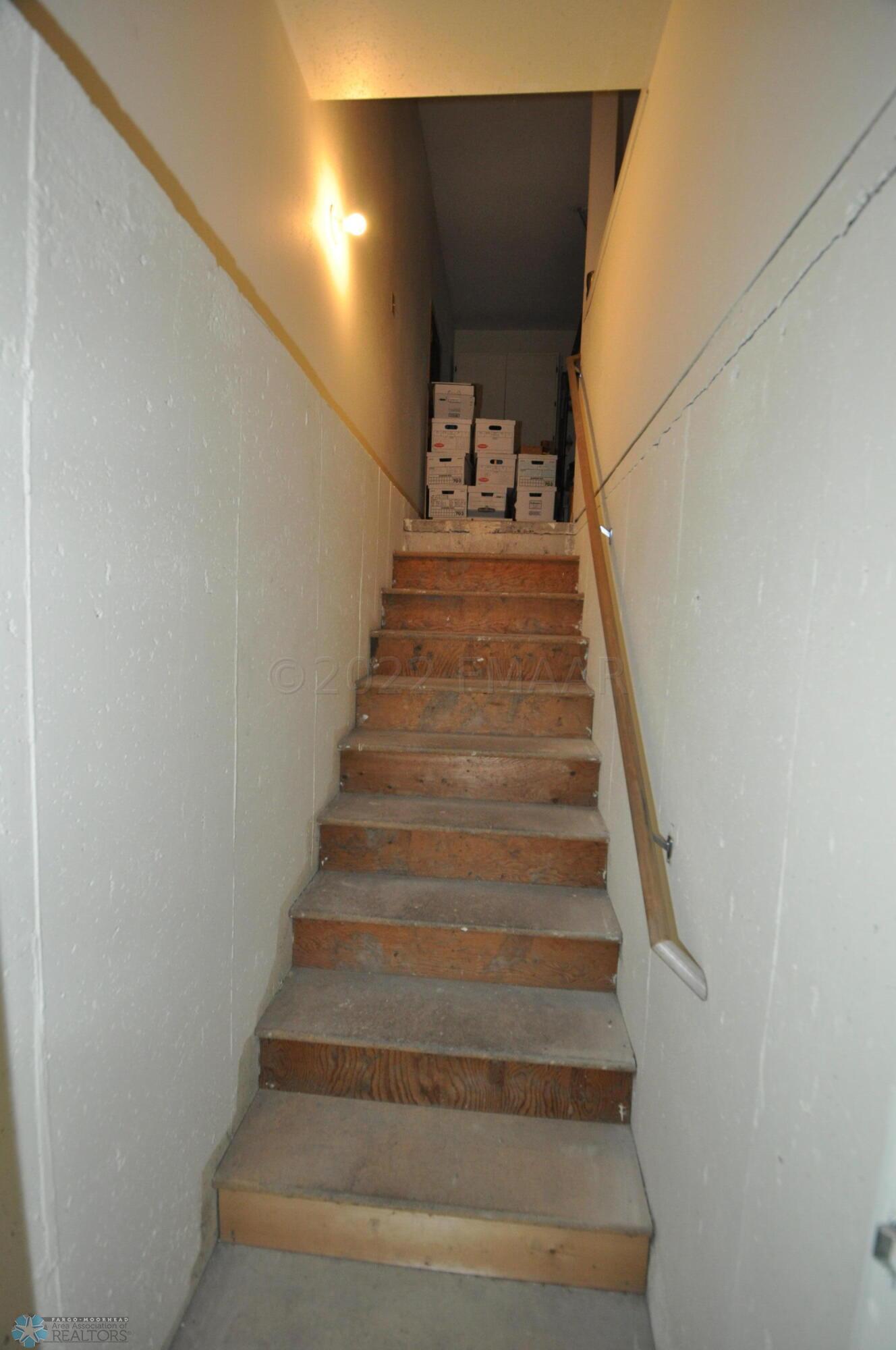 Stair to garage from shop