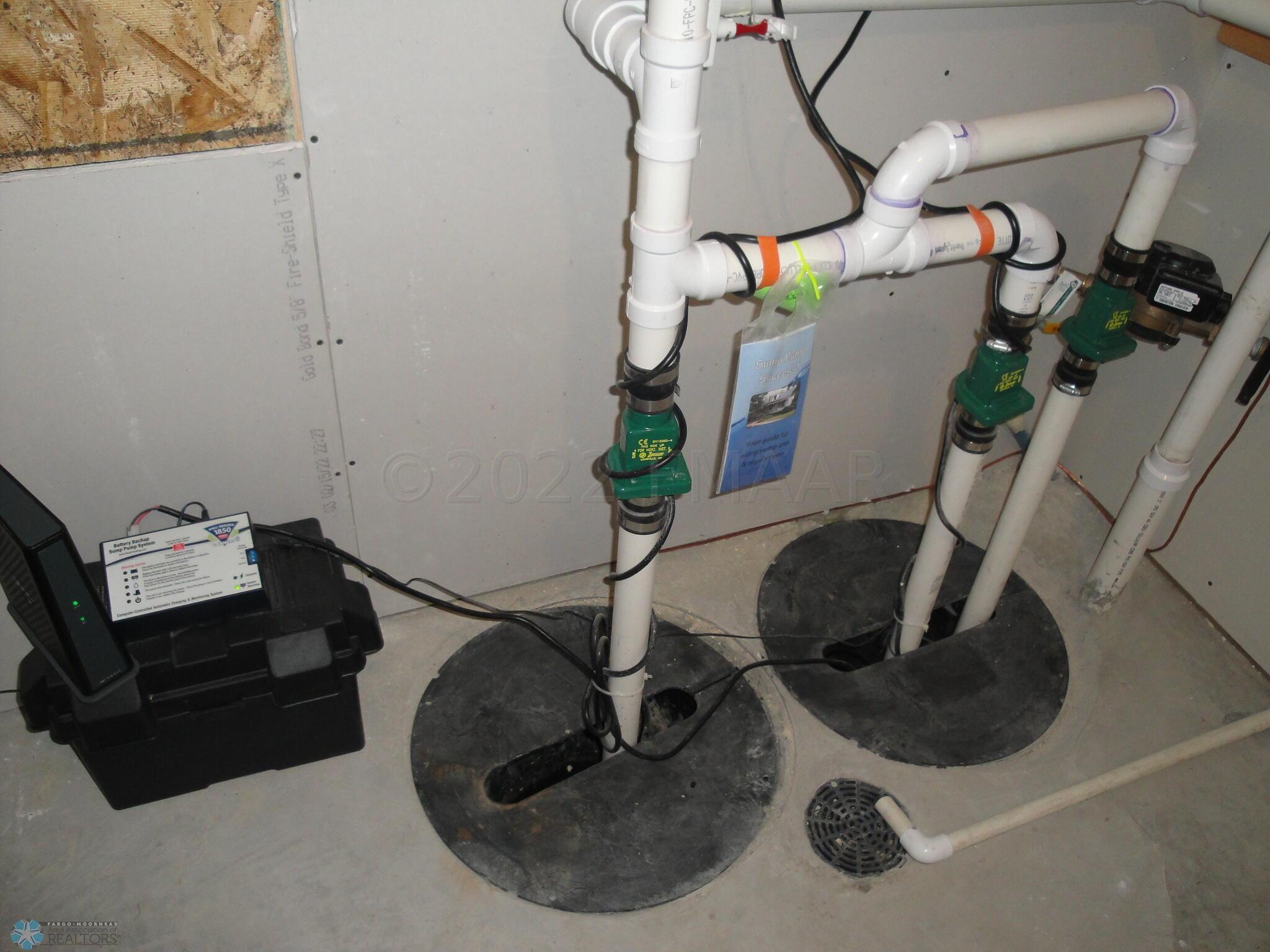 2 sump pumps and pits, battery backup
