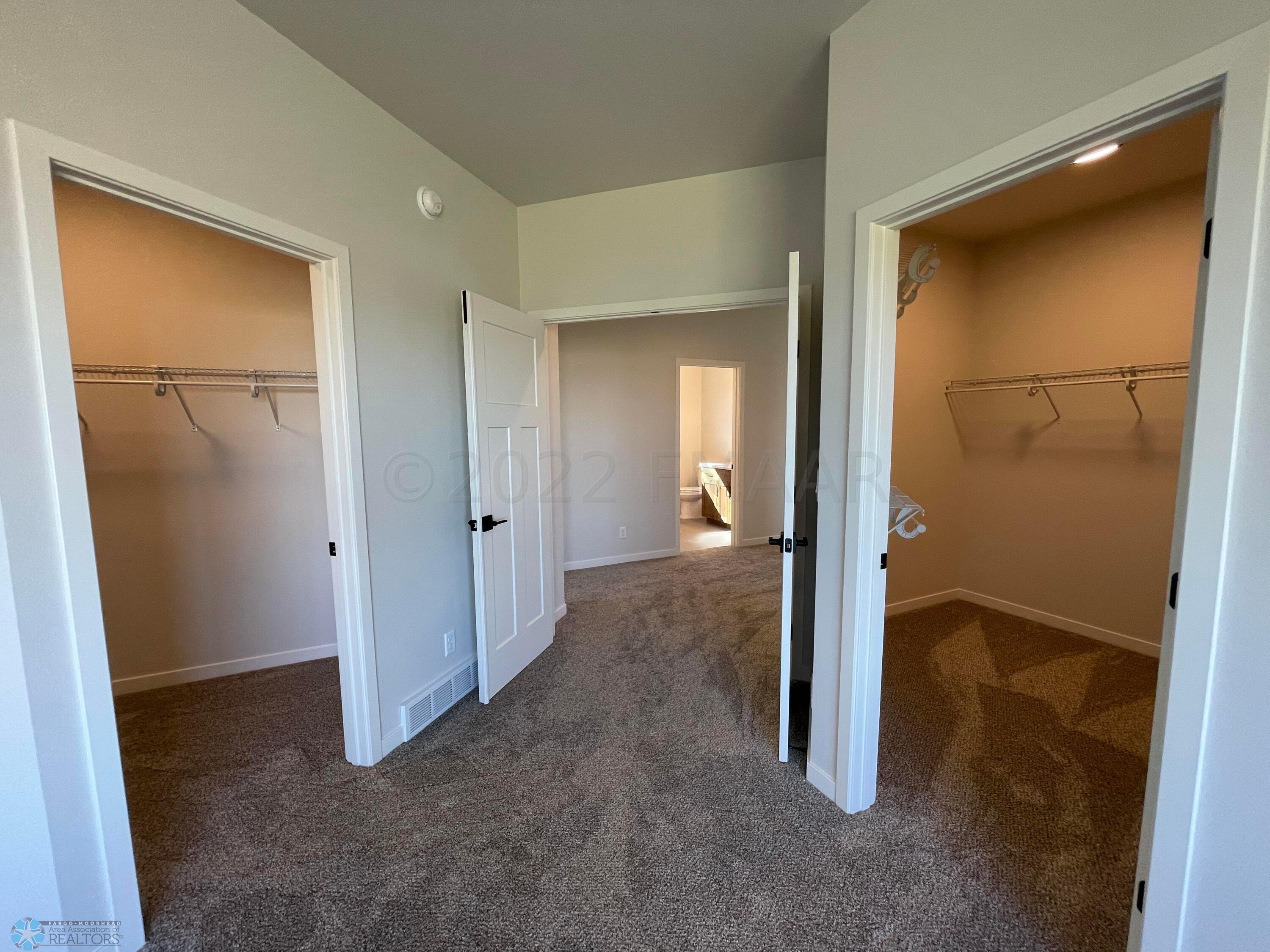 Primary Bedroom Walk-in Closets