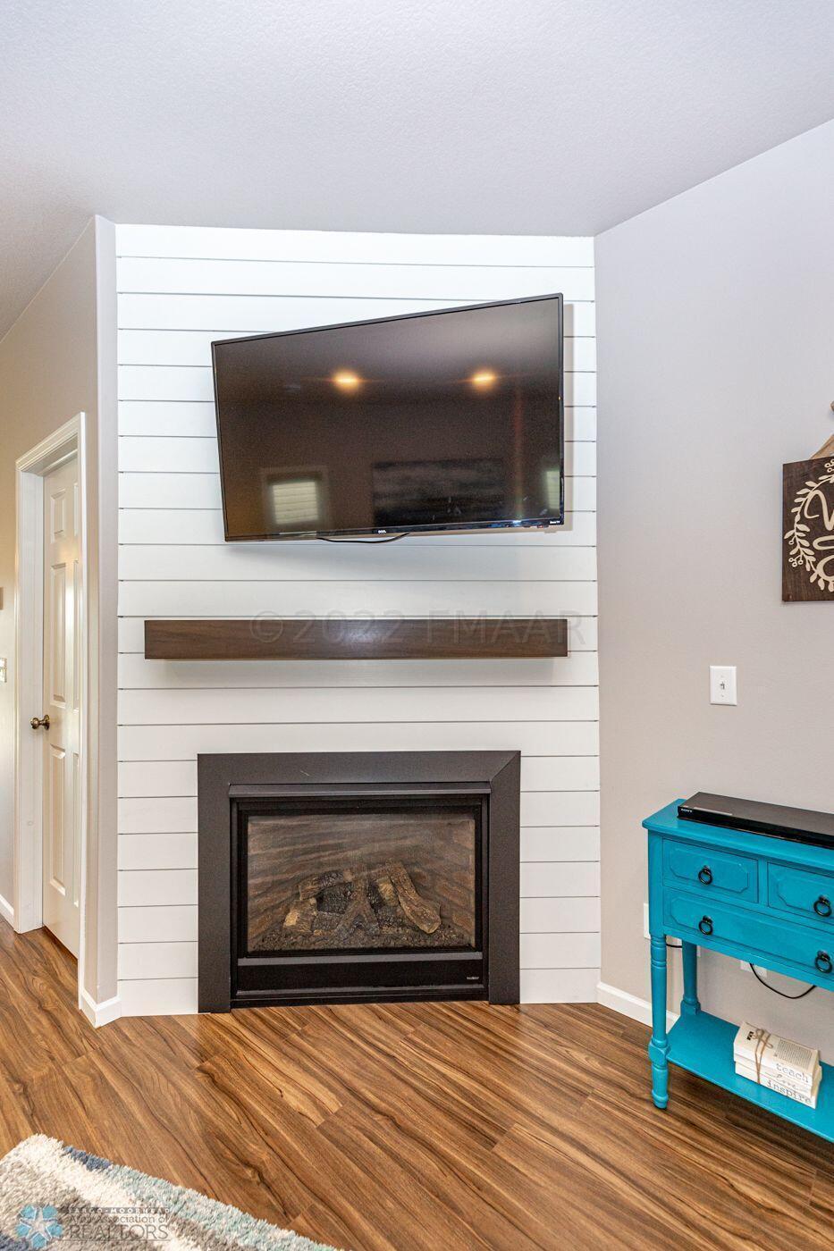 Shiplap with wood mantel