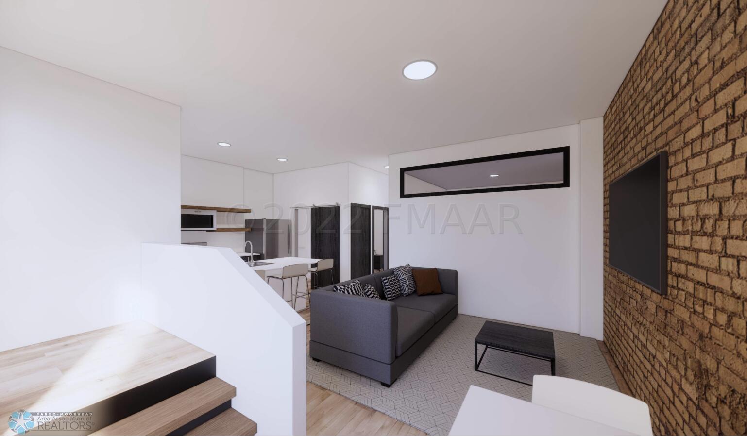 living room and stairs up to Patio
