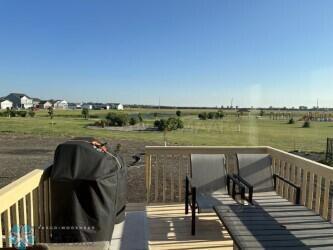 Deck overlooking pond and park