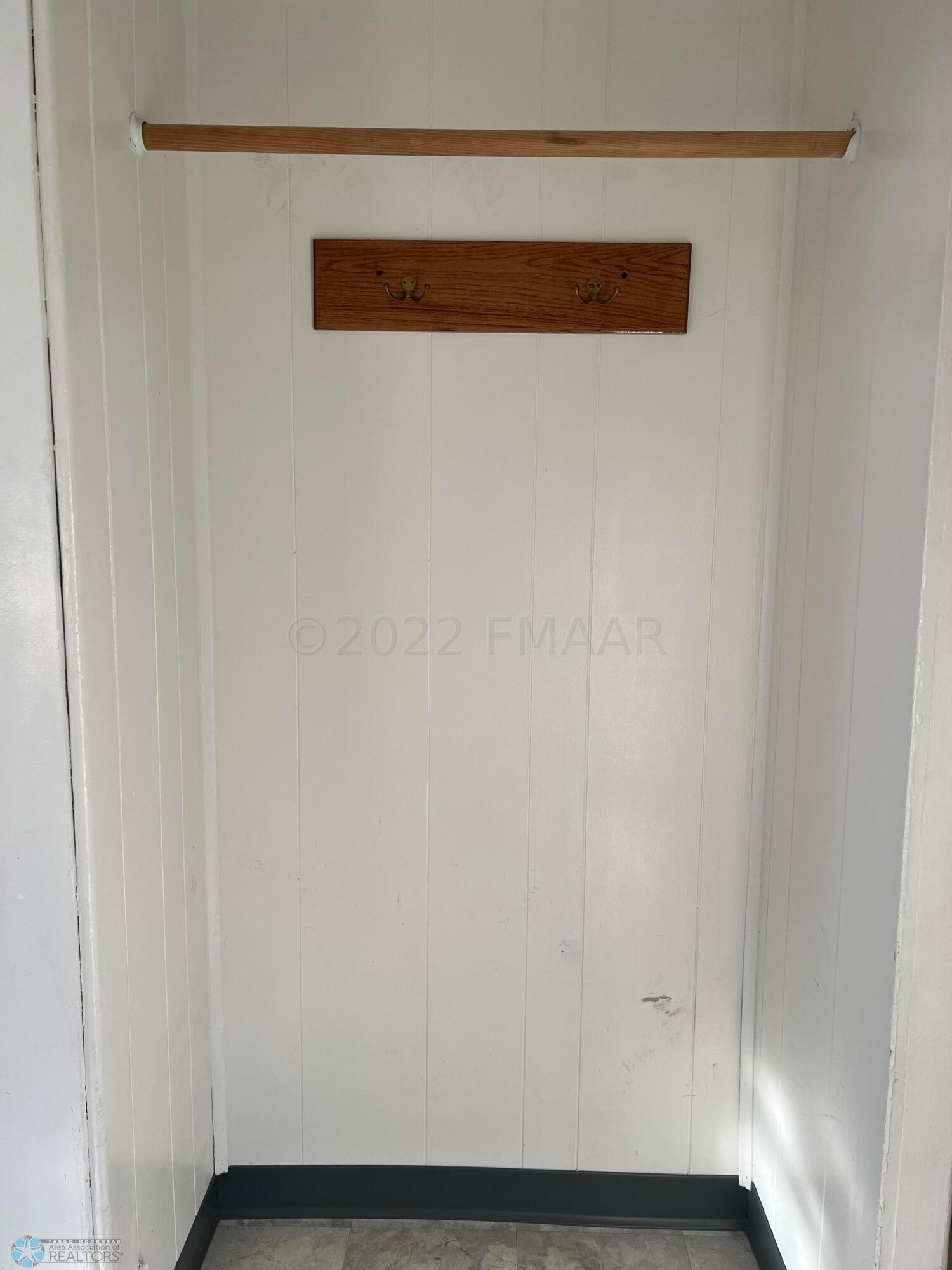 Coat rod by side door