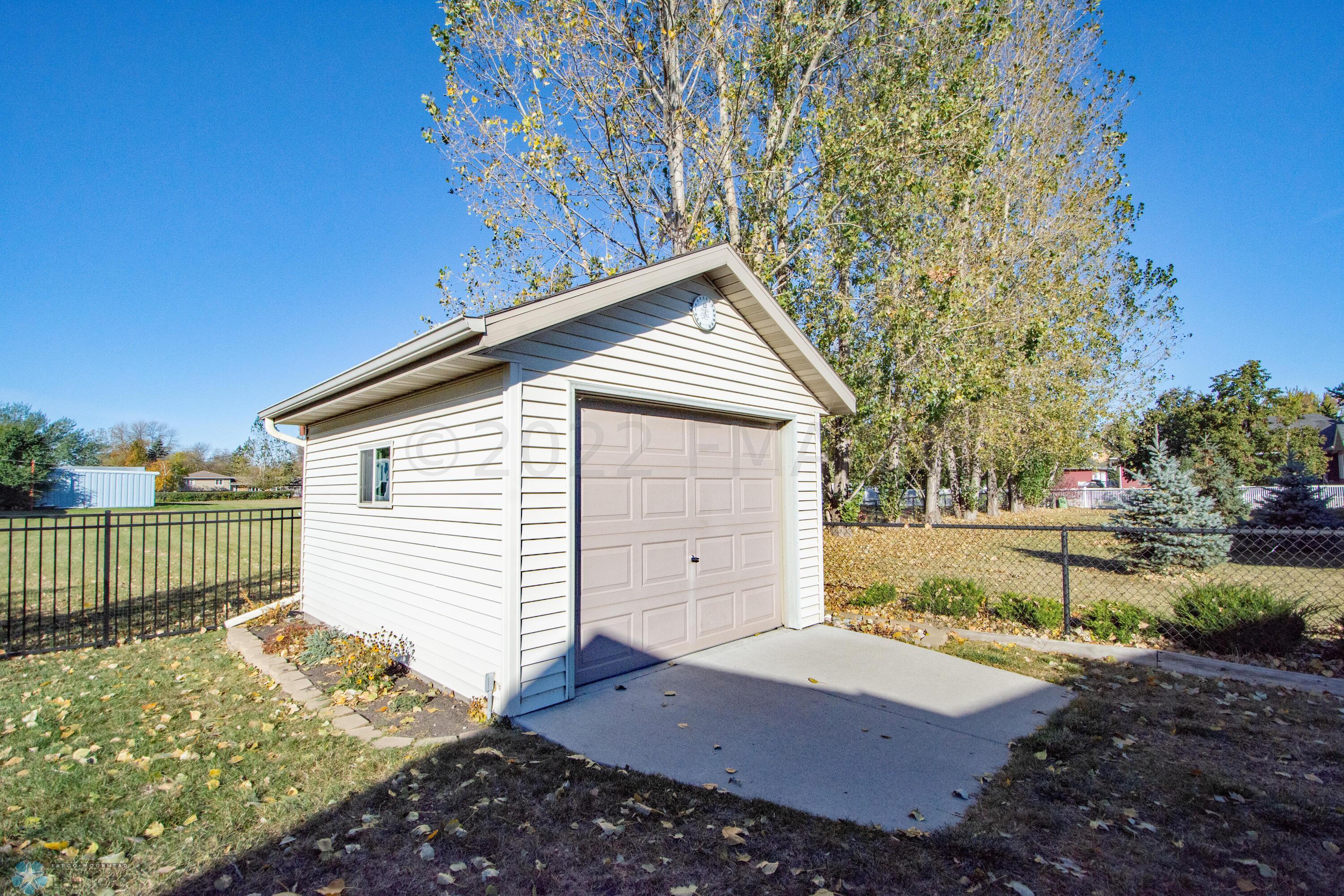 Storage Shed with Garage Door