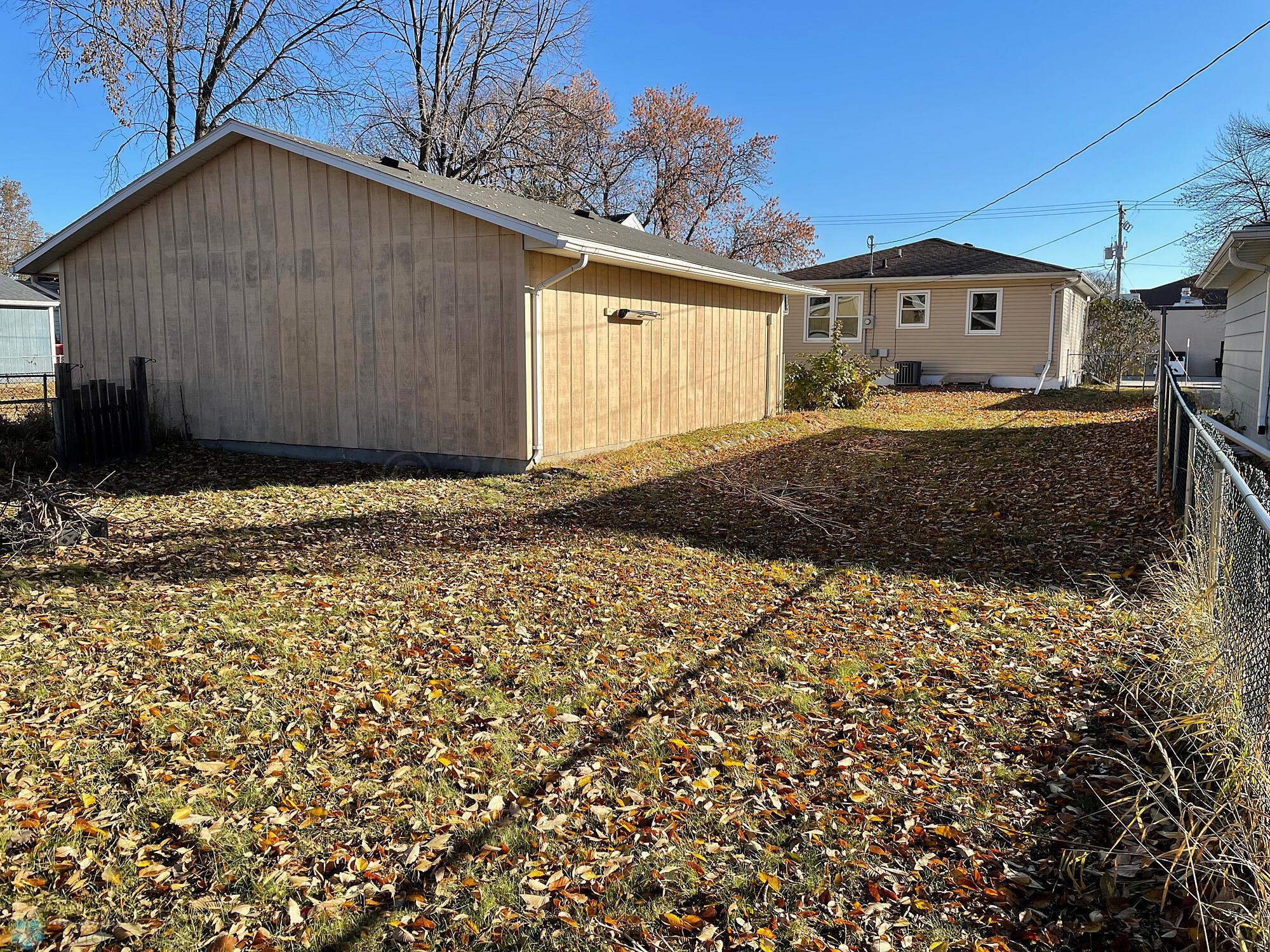 Back yard view to the garage and house