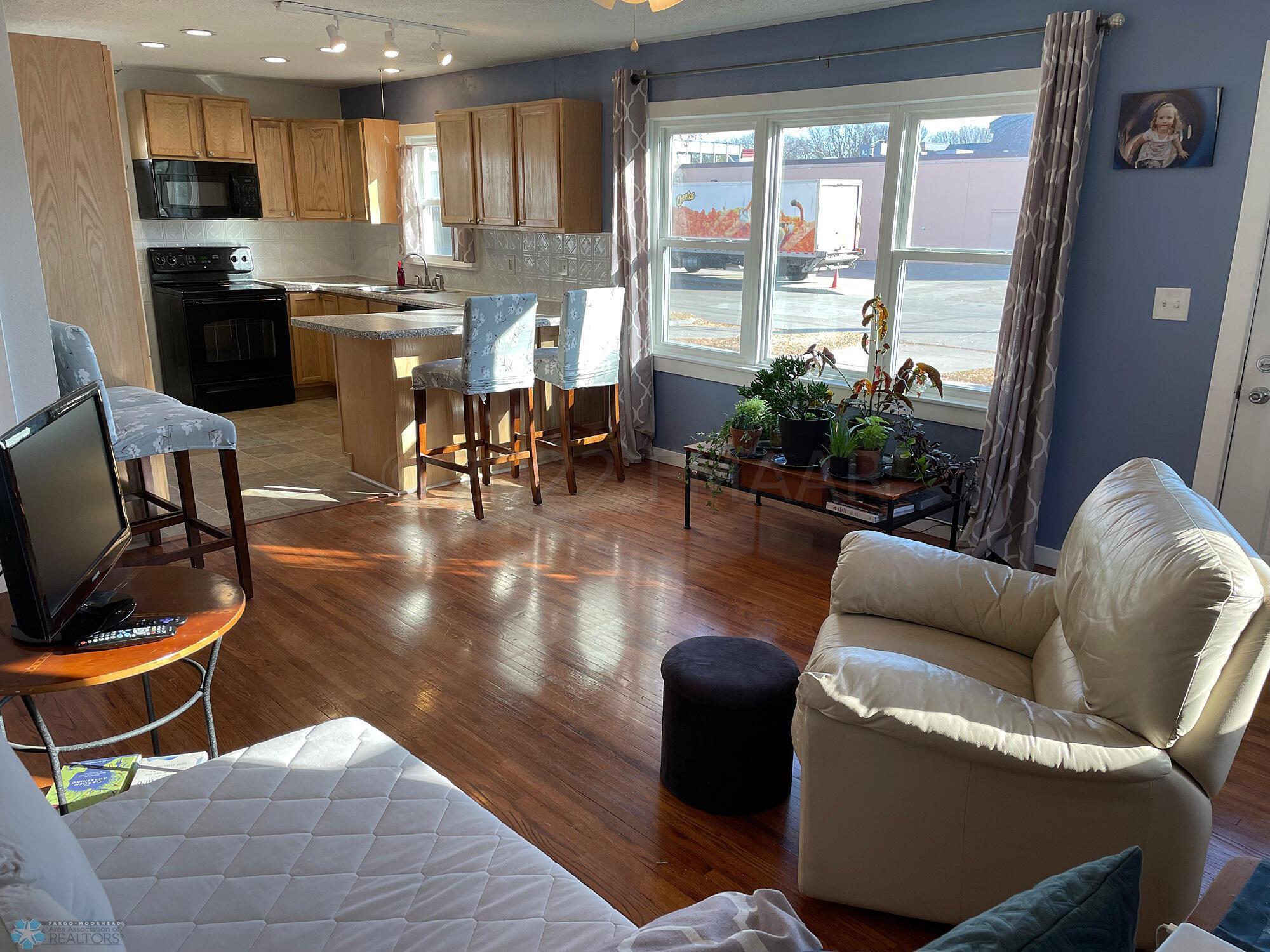 Living room with oak floor-view to kitch