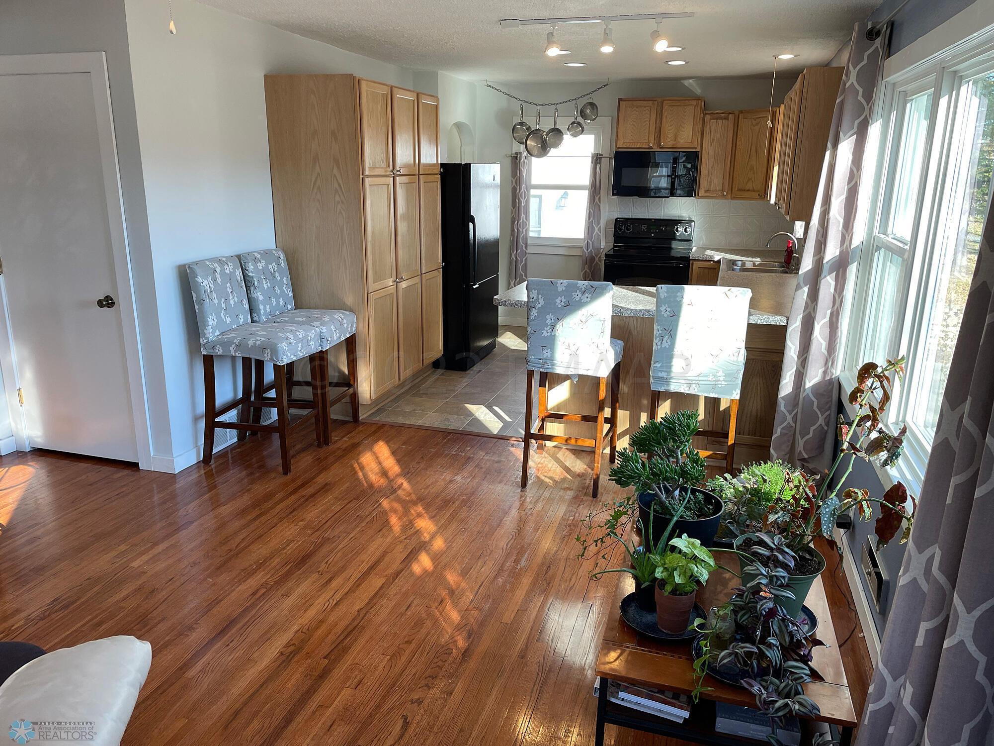 Living room with oak floor-view to kitch