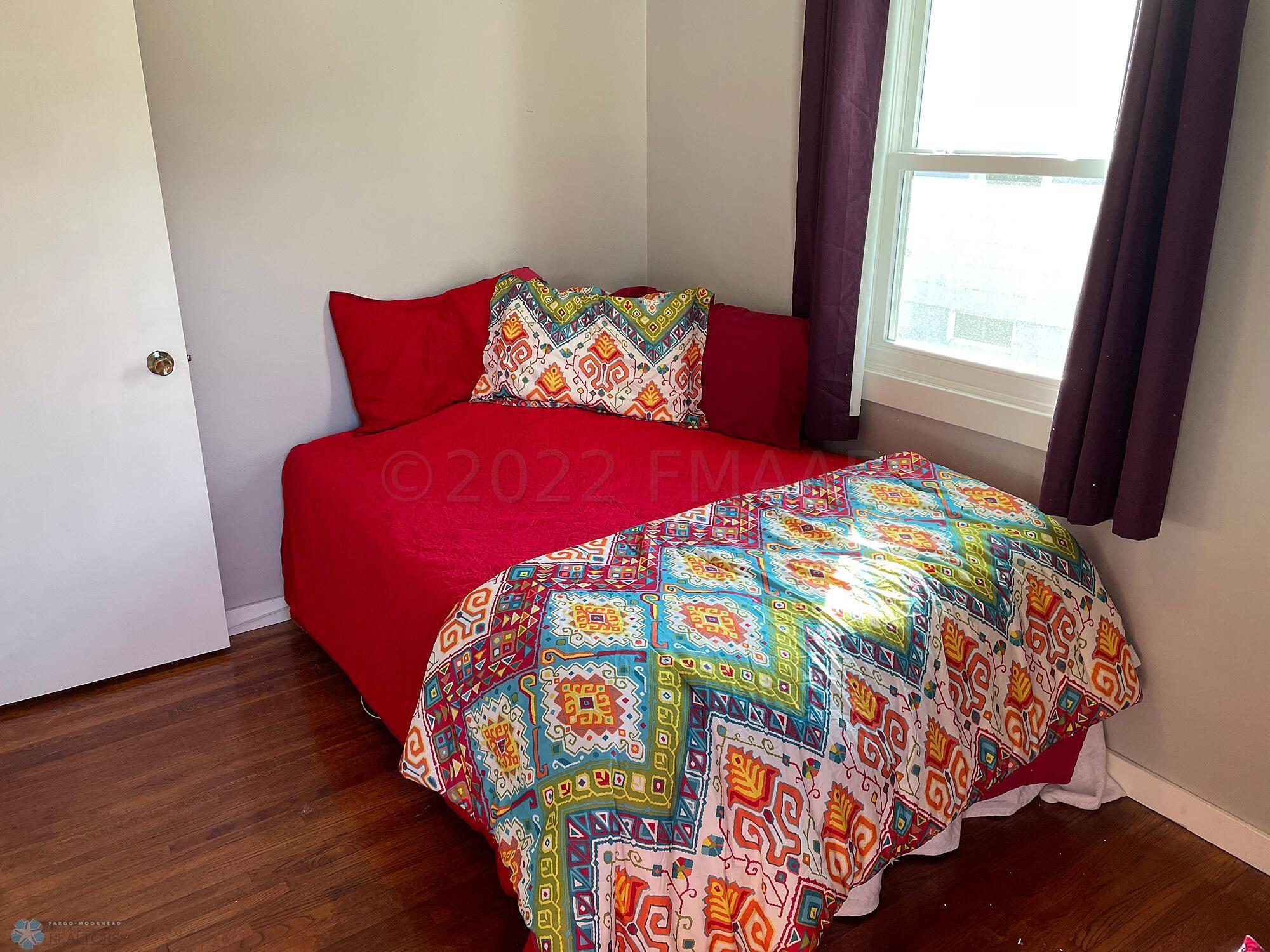 Bedroom 2 with oak floor-view 2