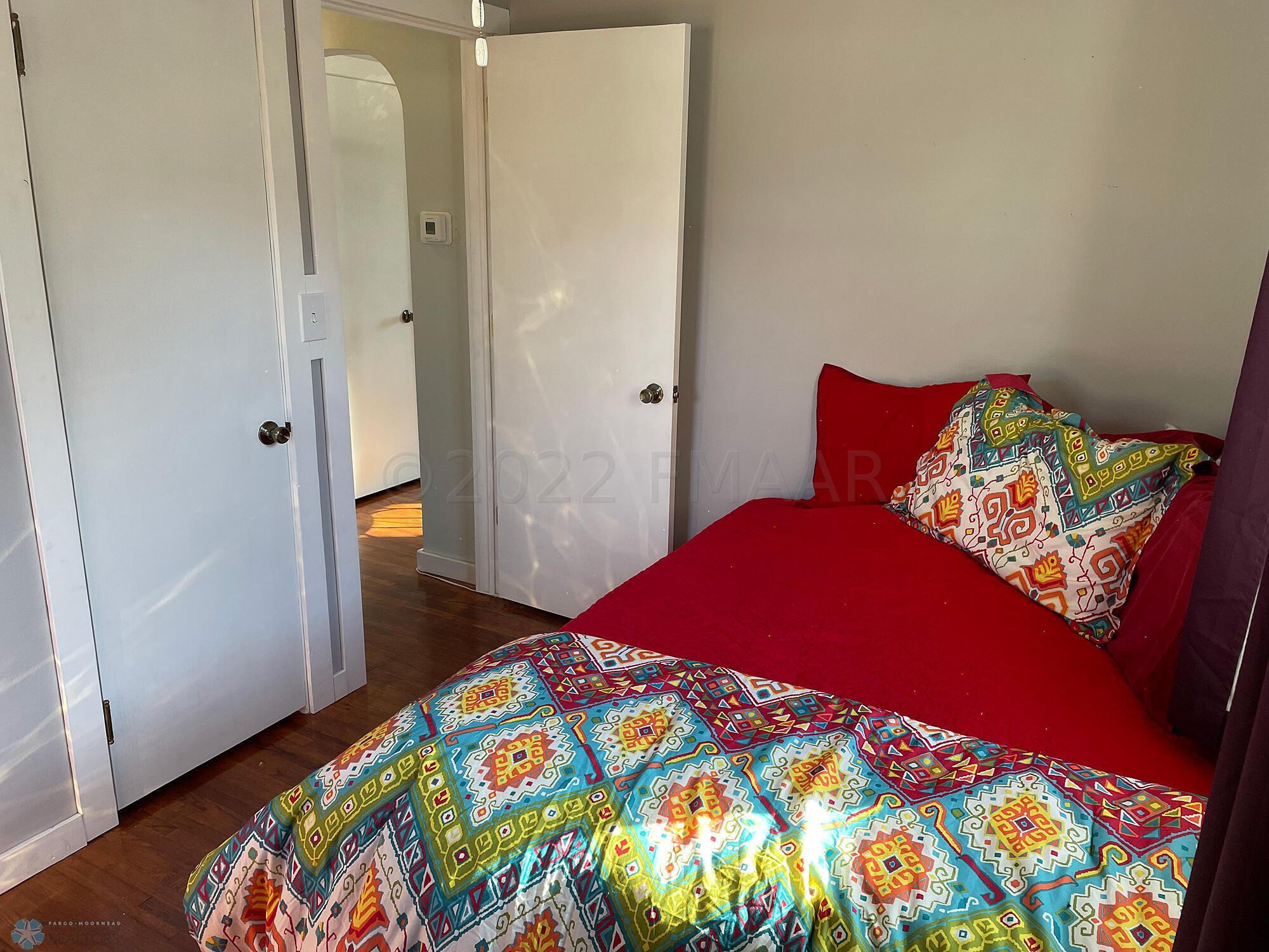 Bedroom 2 with oak floor-view 3