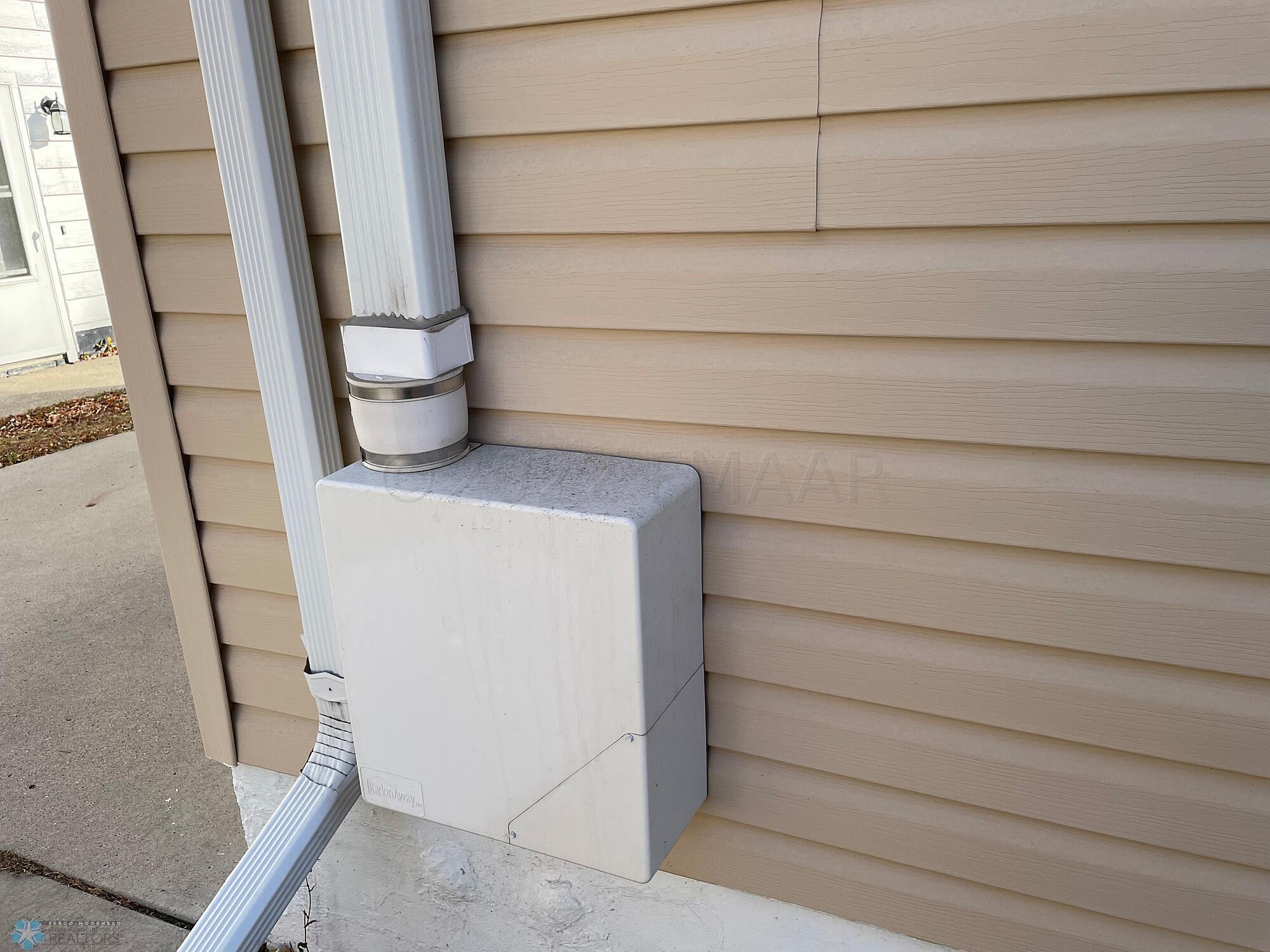 Radon mitigation system exterior fan box