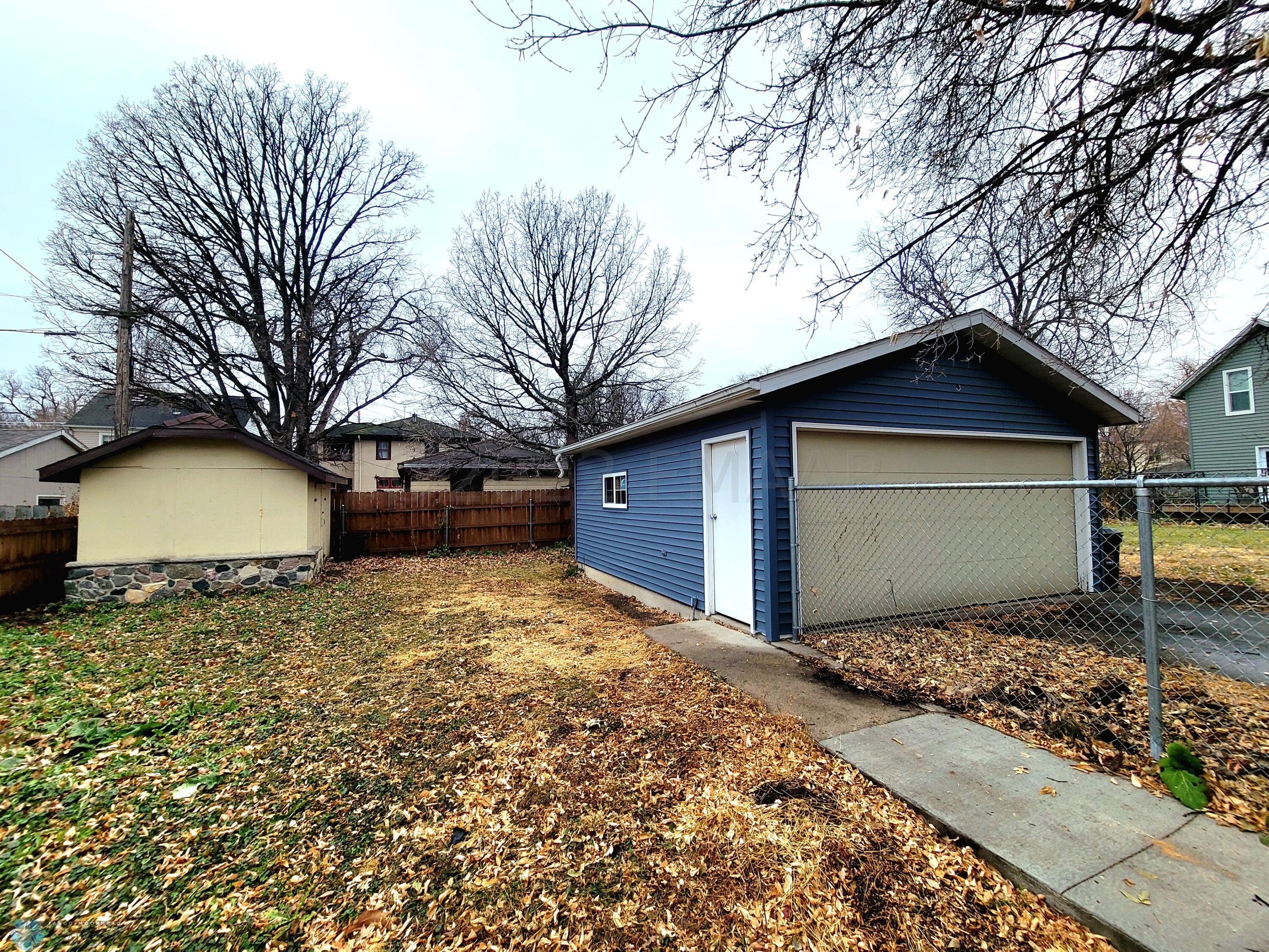 Backyard fenced and storage shed