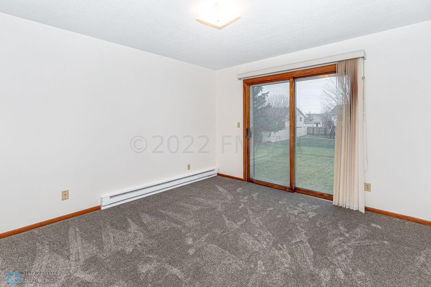 Main level Bedroom with patio doors