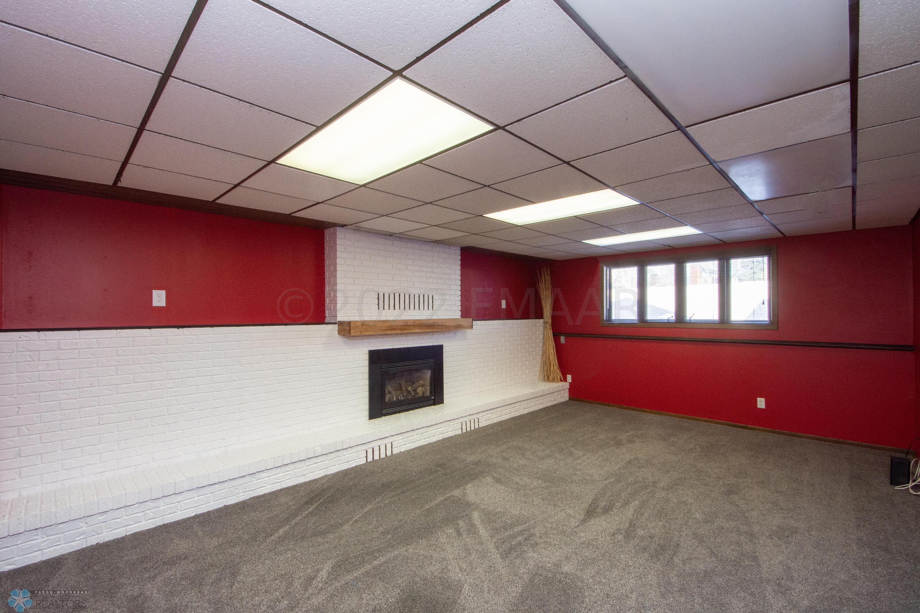 lower family room with gas fireplace