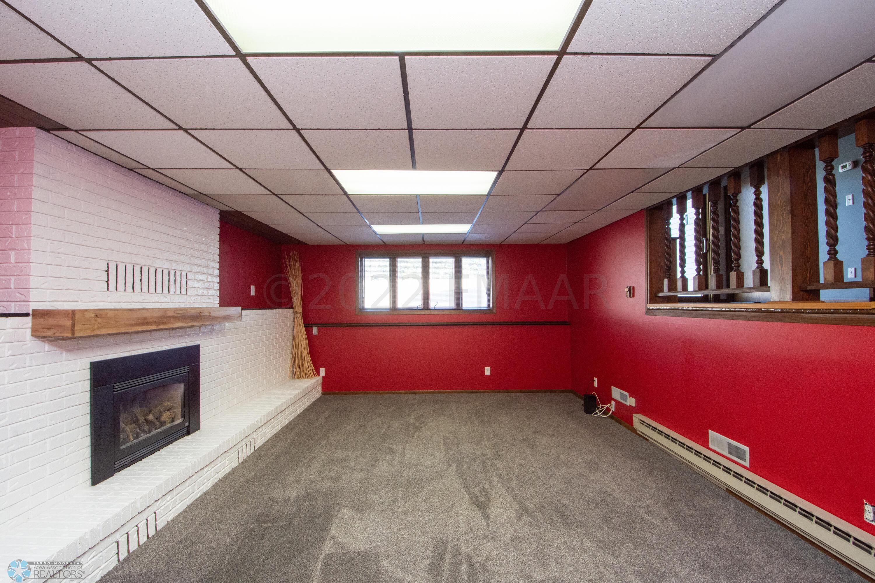lower family room with gas fireplace