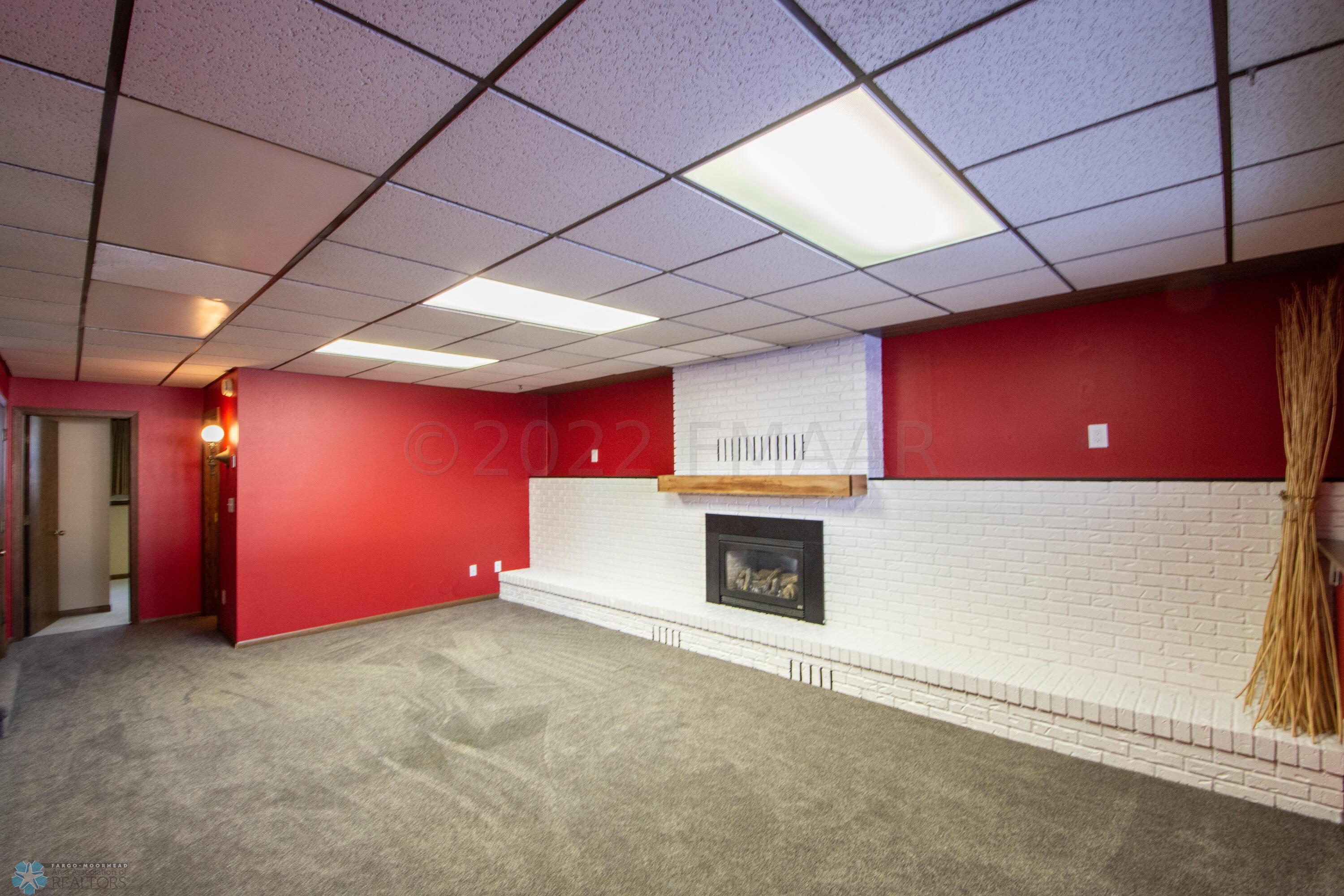 lower family room with gas fireplace