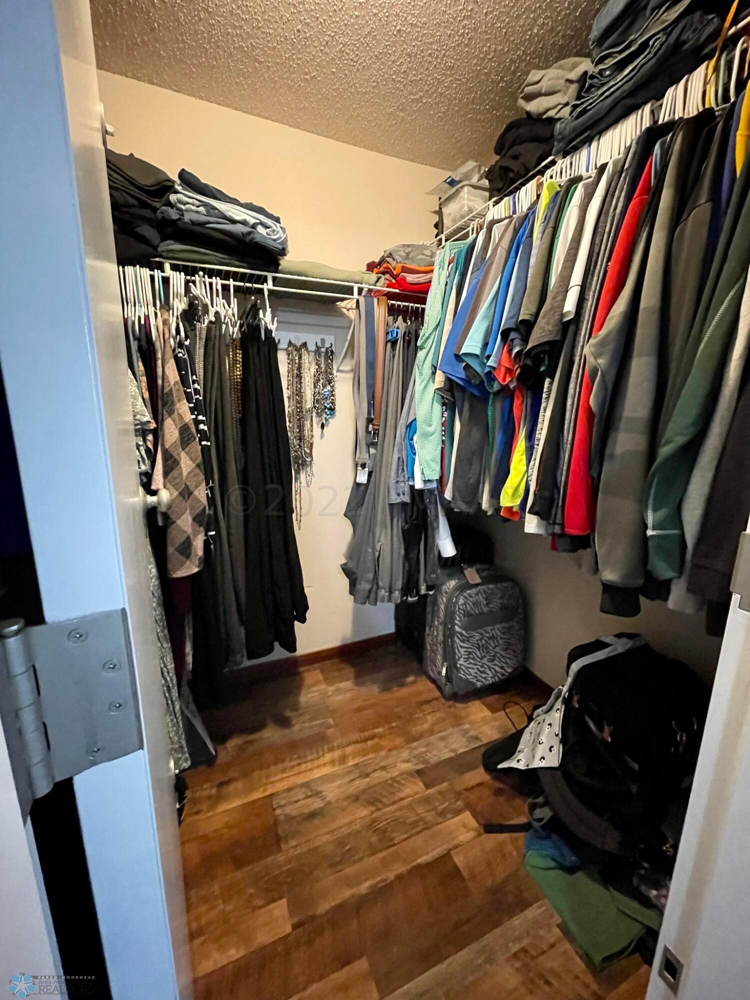 Primary walk-in closet.