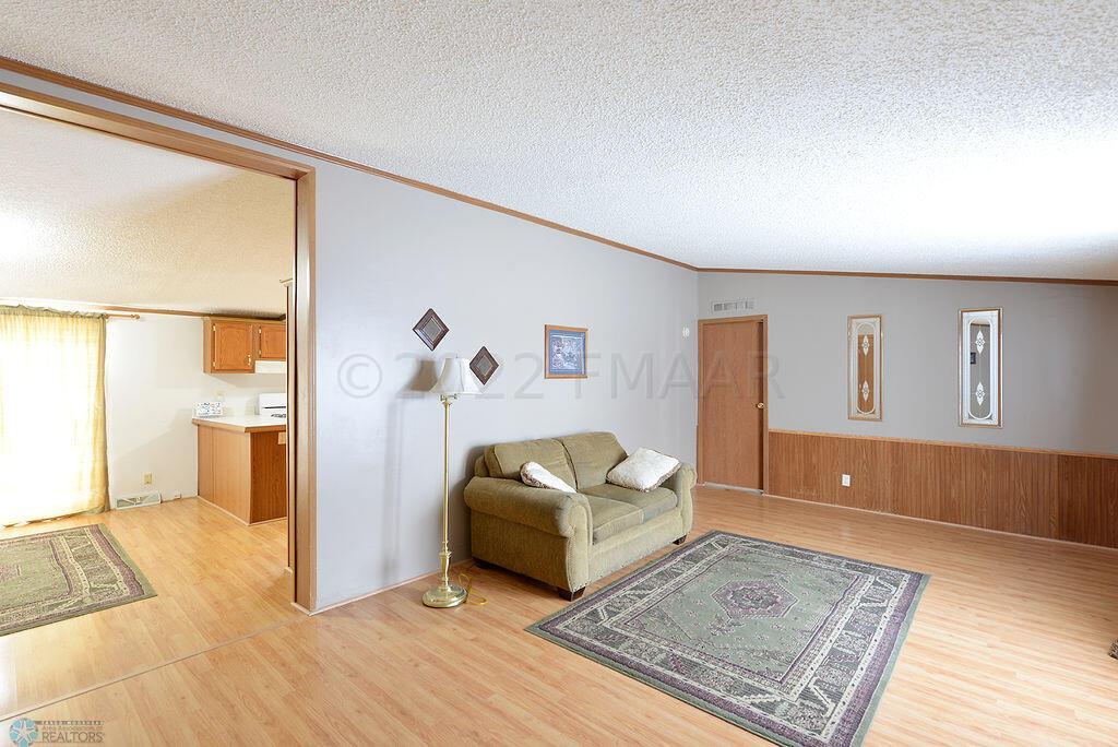 Living Room With Door To Primary Suite