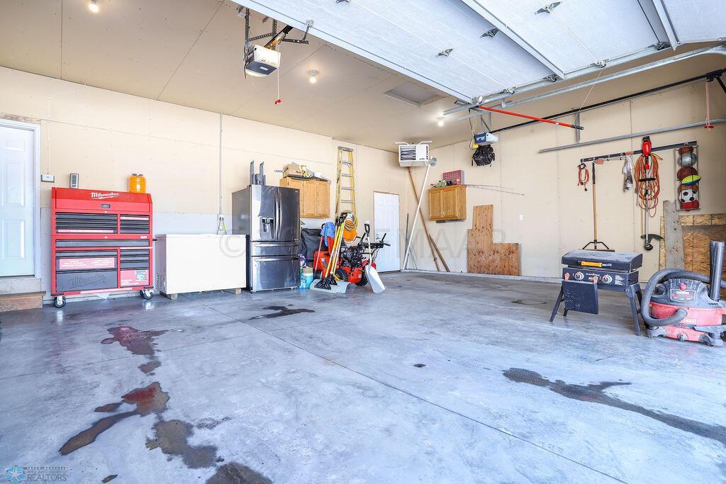 3 stall finished heated garage.