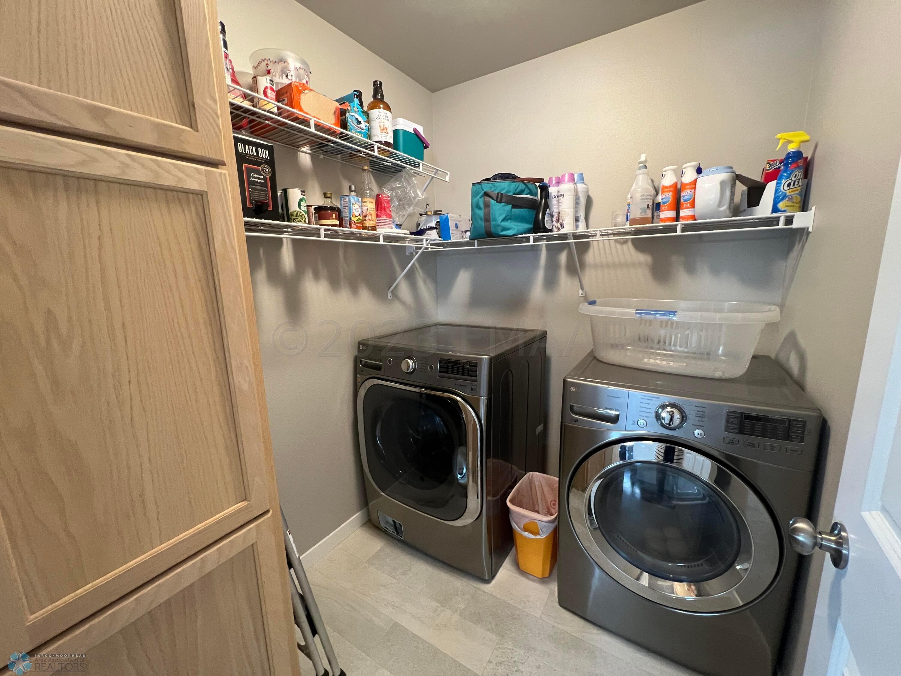 Laundry room with storage cabinet