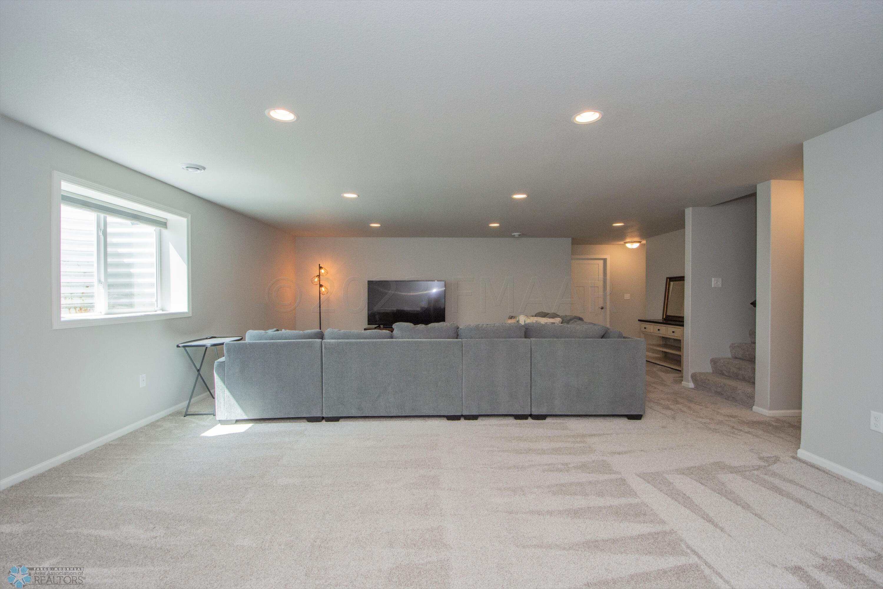Basement Living area w/ wet-bar plumbed