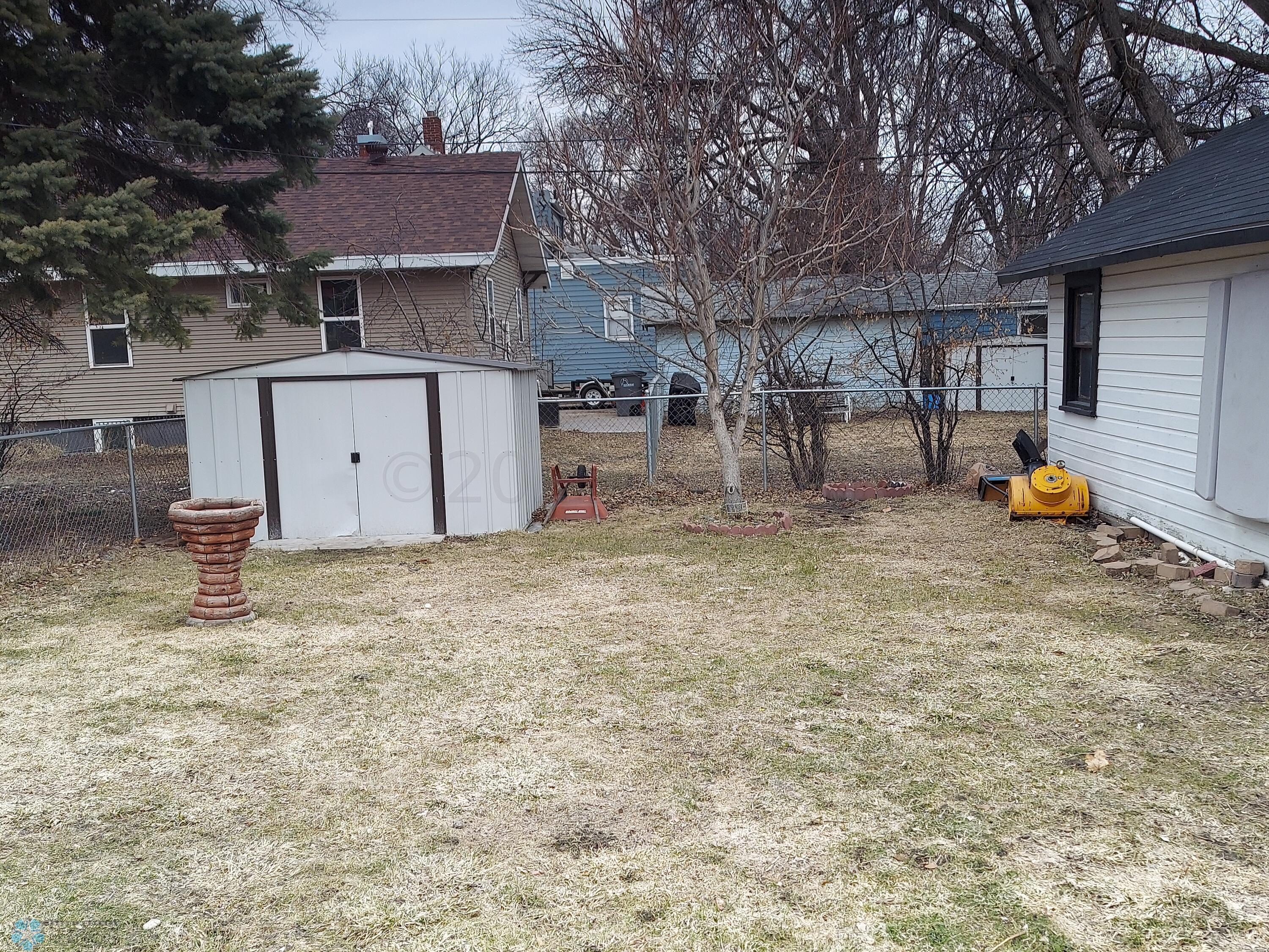 Storage Shed & Fenced Back Yard