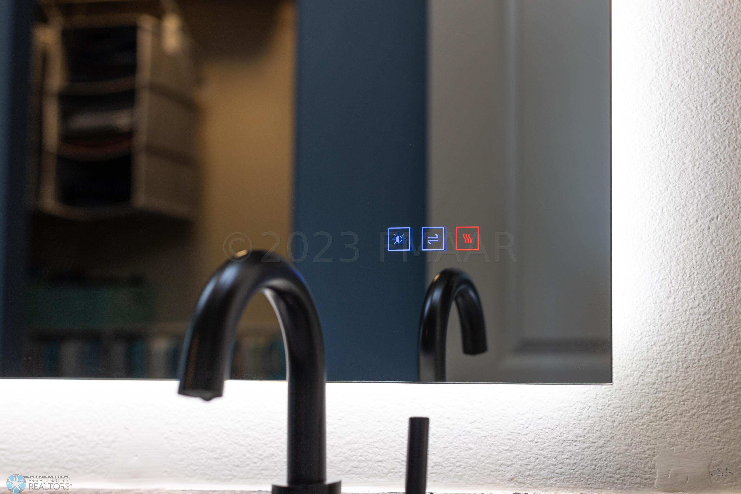 Touch Light Mirror in Primary Bathroom