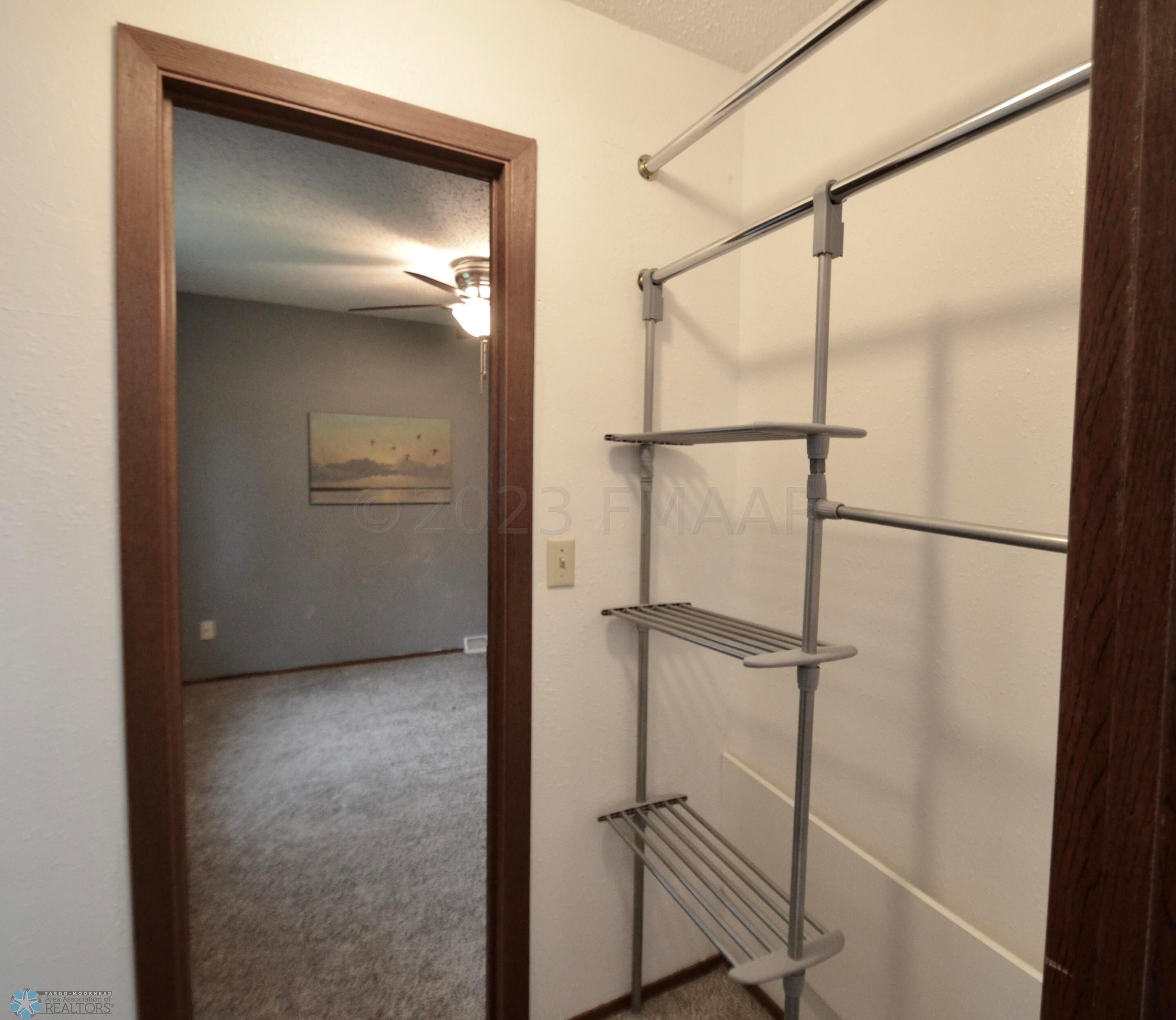 Primary Closet to Primary Bedroom 1