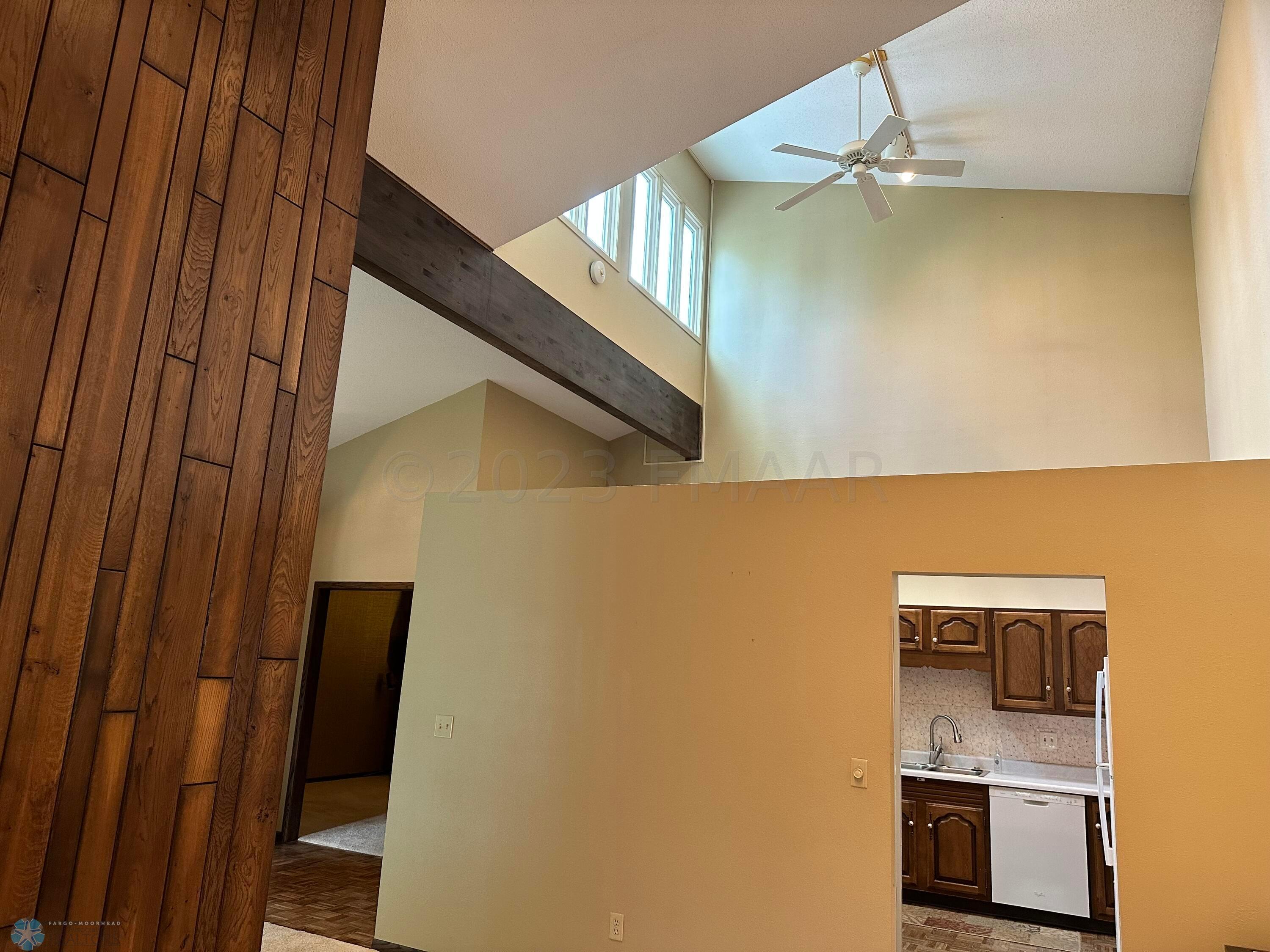 Ceiling fan & high windows!