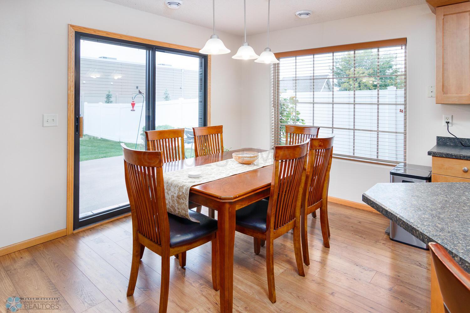 Dining room leading to concrete patio