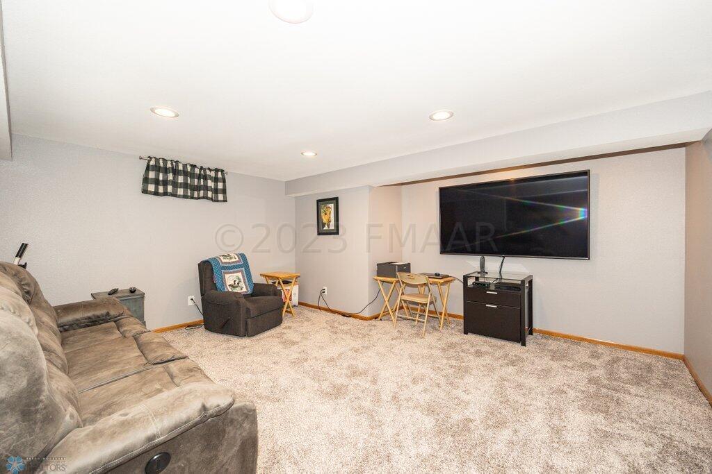 Family room with 75" tv and couch