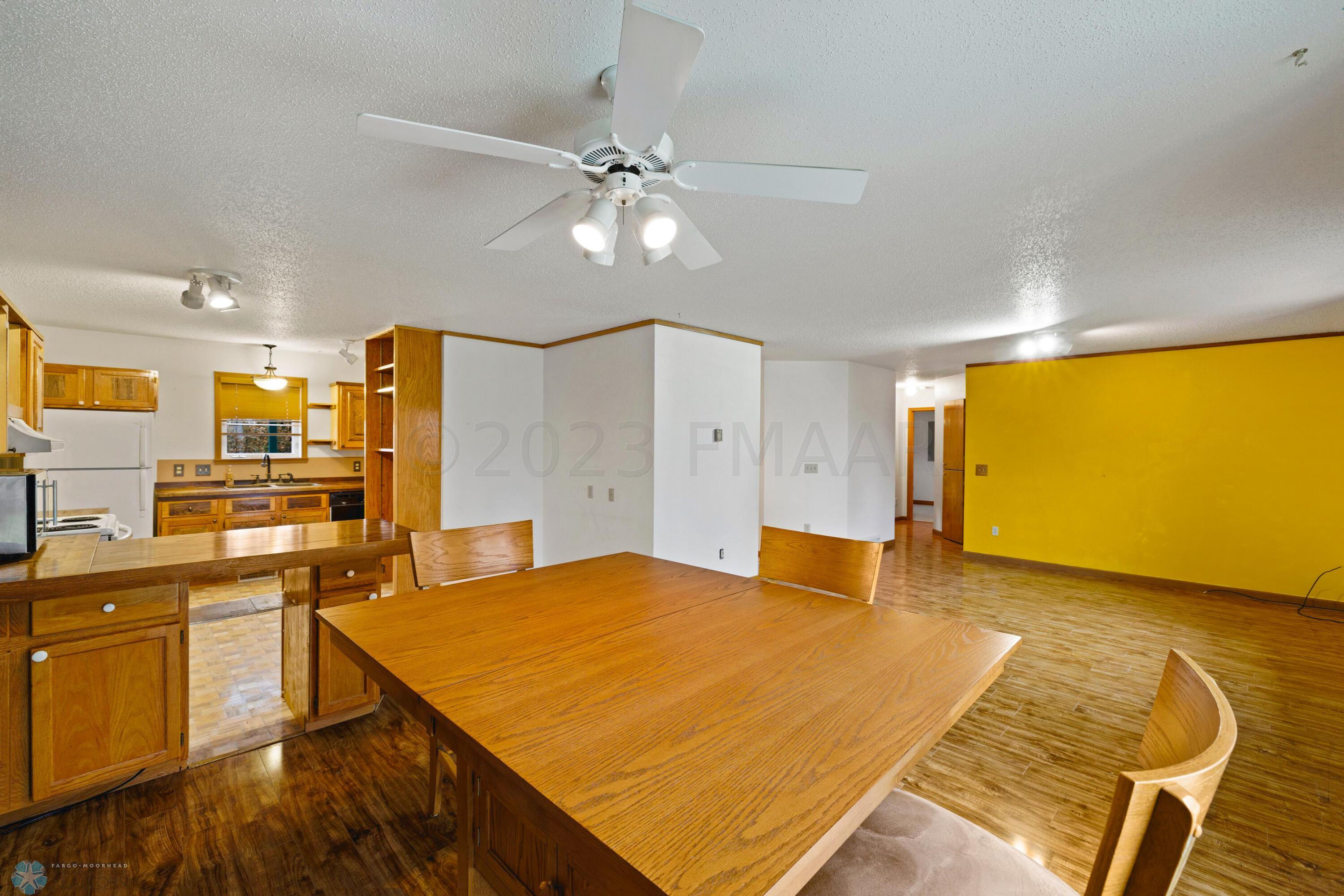 Dining overlooking living room & kitchen