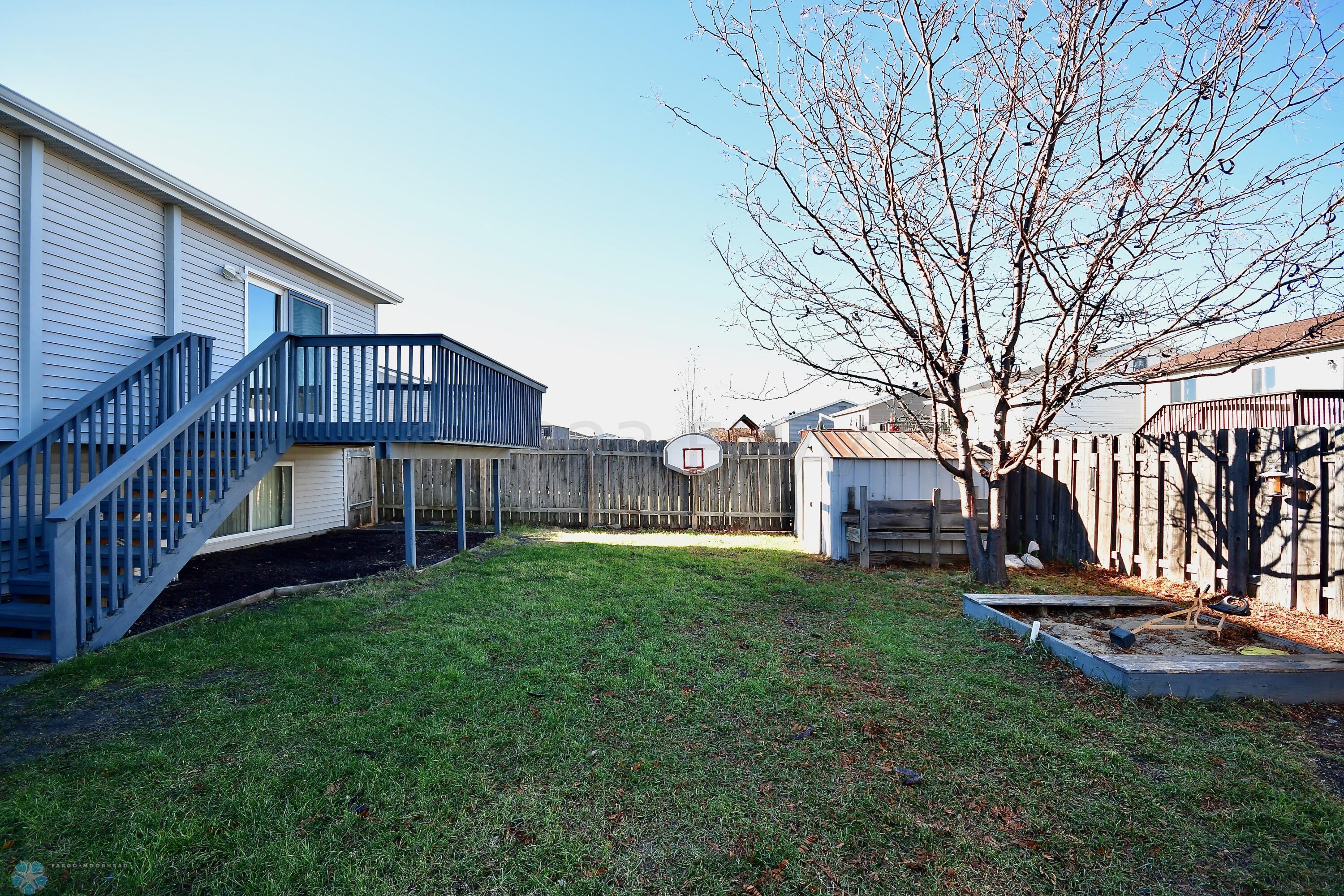 Backyard with Storage Shed & Sandbox