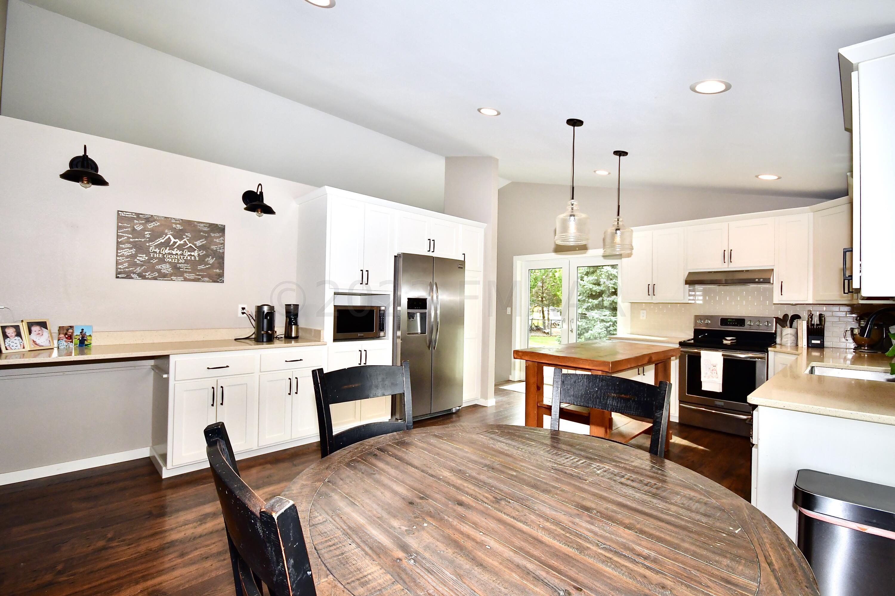 Dining View to Breakfast Bar/Kitchen