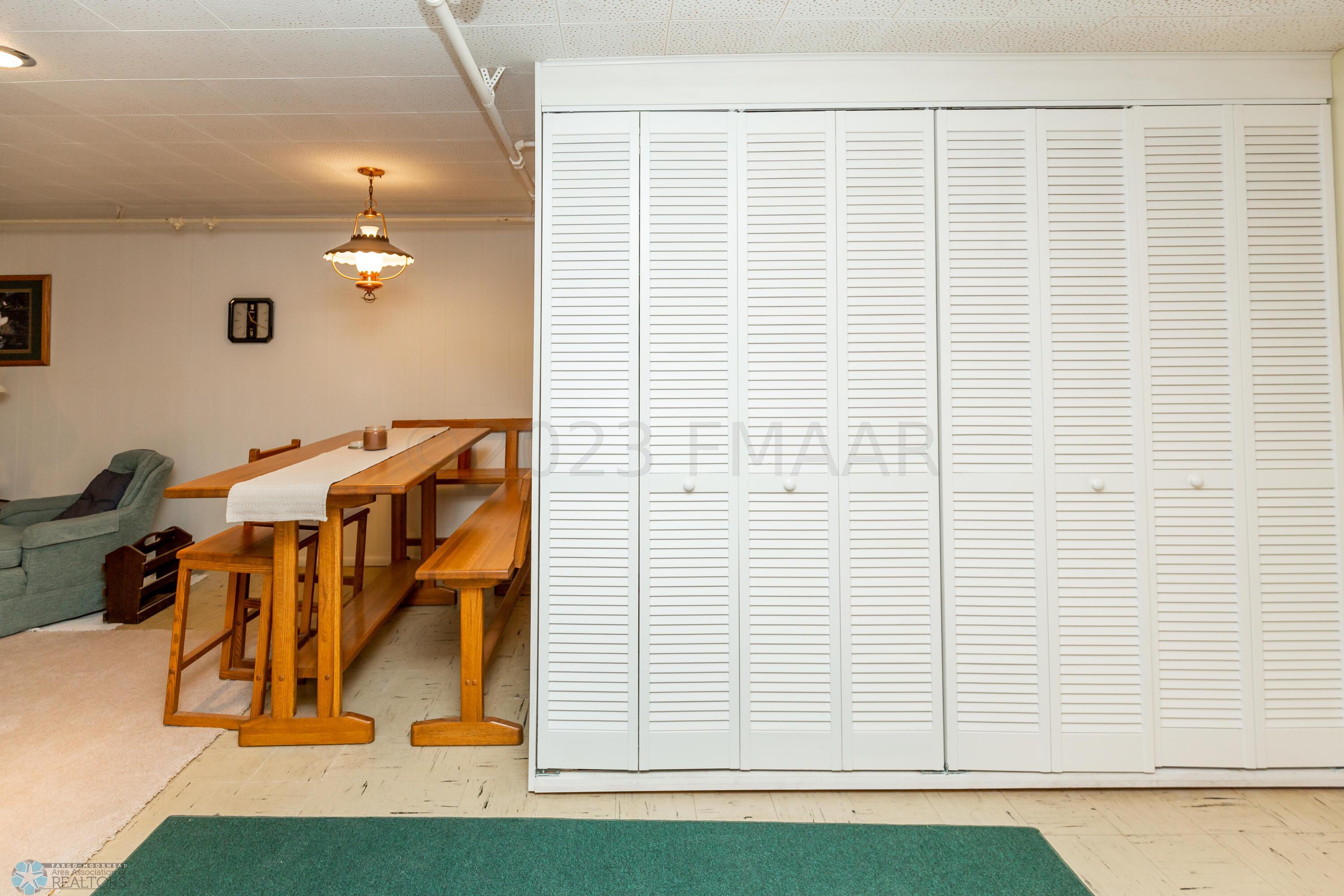 Storage at bottom of the basement stairs